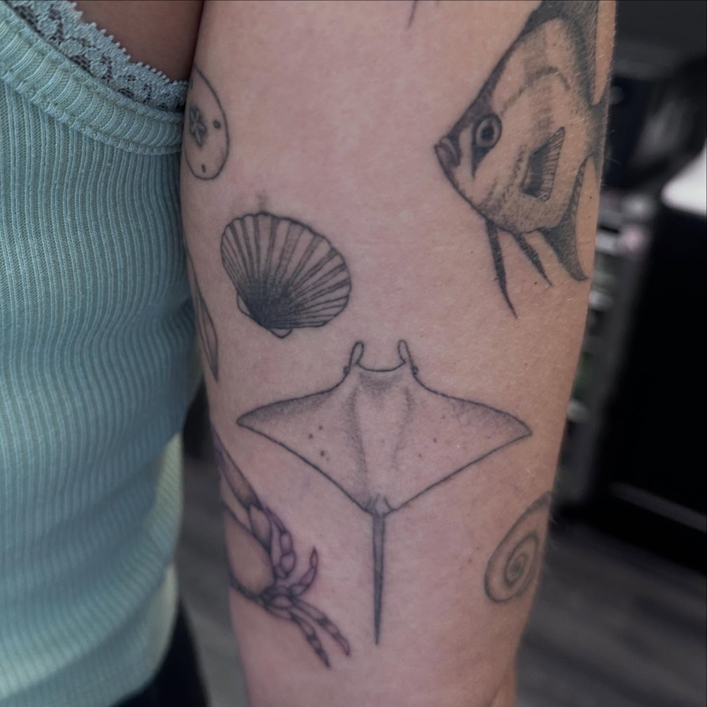 Marine life black and grey tattoo on the forearm by Bell