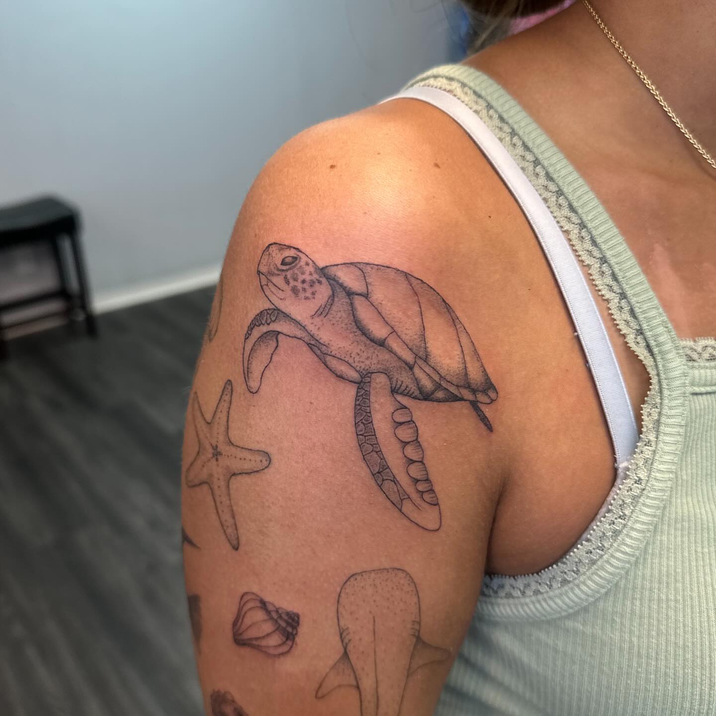 Sea turtle realism tattoo on the shoulder by Bell