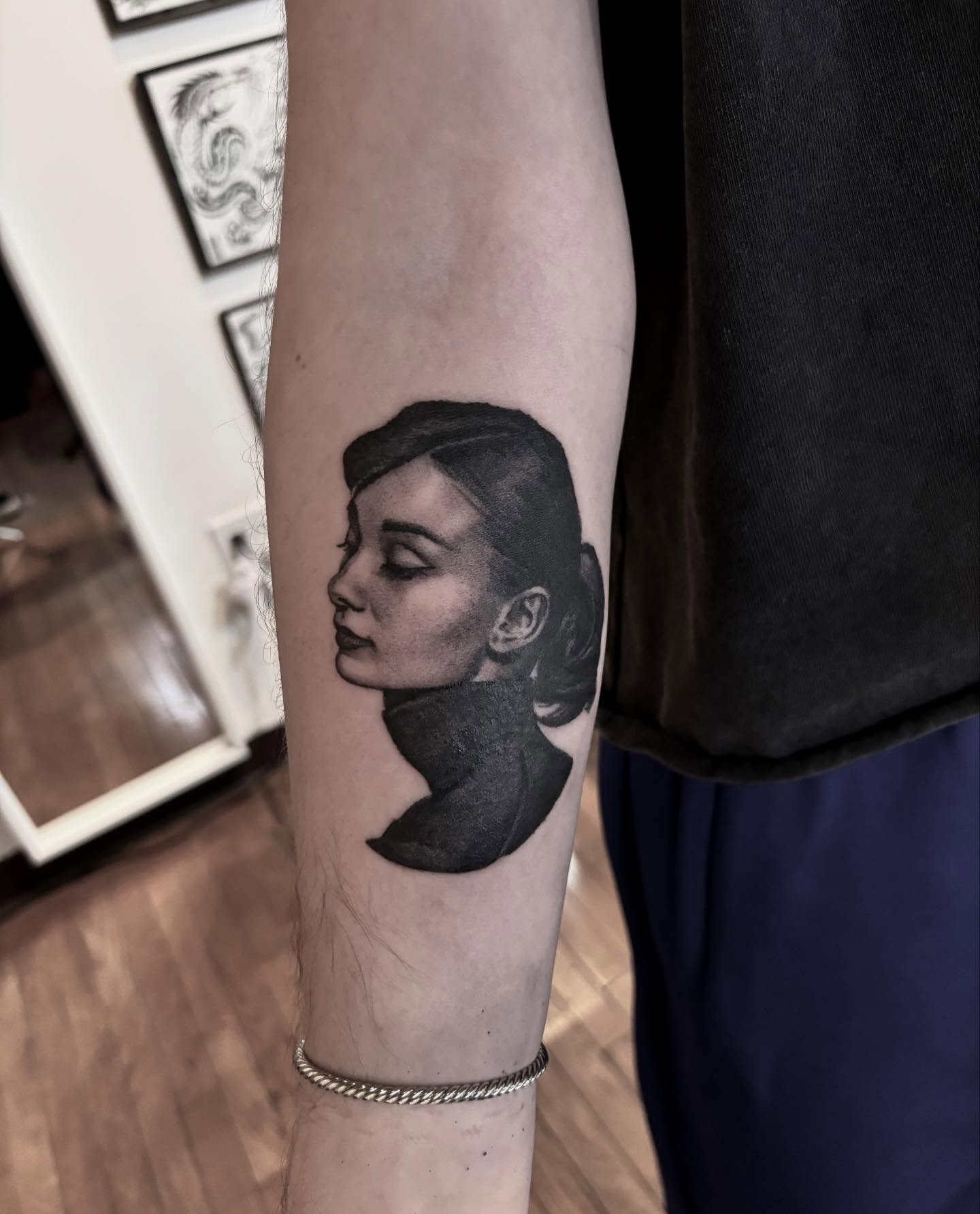 Portrait realism tattoo on the forearm by Dylan Coverdale