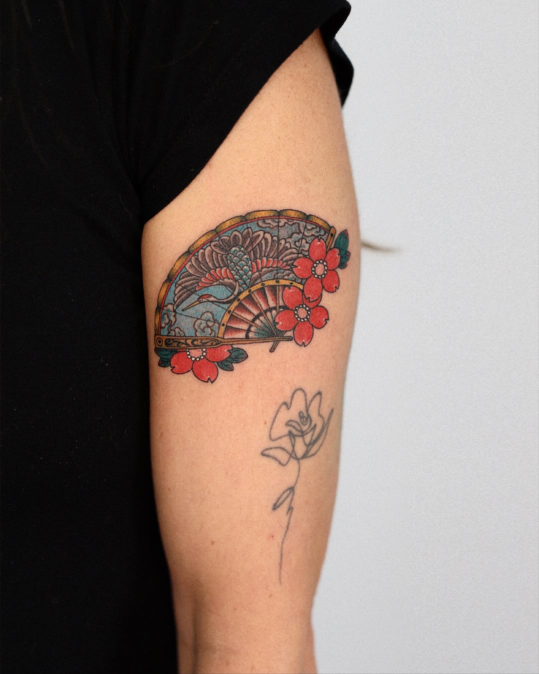 Fan and flowers japanese irezumi tattoo on the forearm by 홍대타투