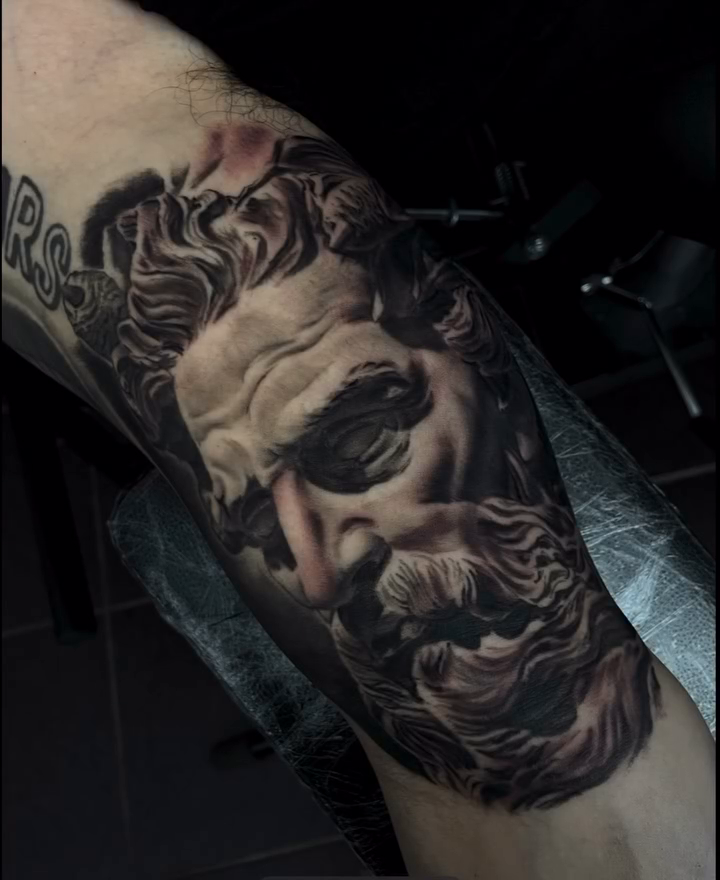 Tattoo by @obsidianinkstudio — realism, black_and_grey
