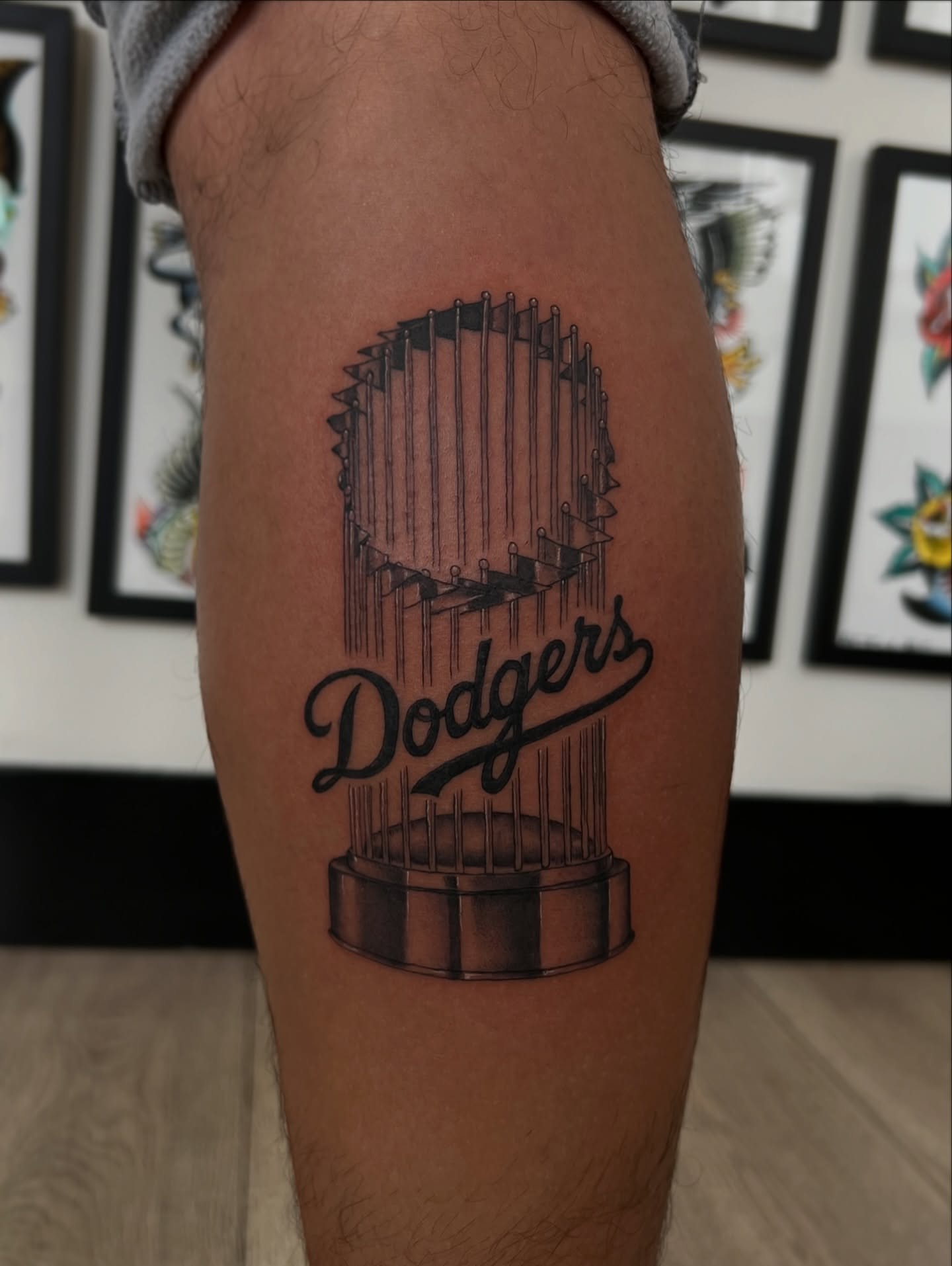 Dodgers trophy black and grey tattoo on the thigh by Nick Bridwell, Downey, California