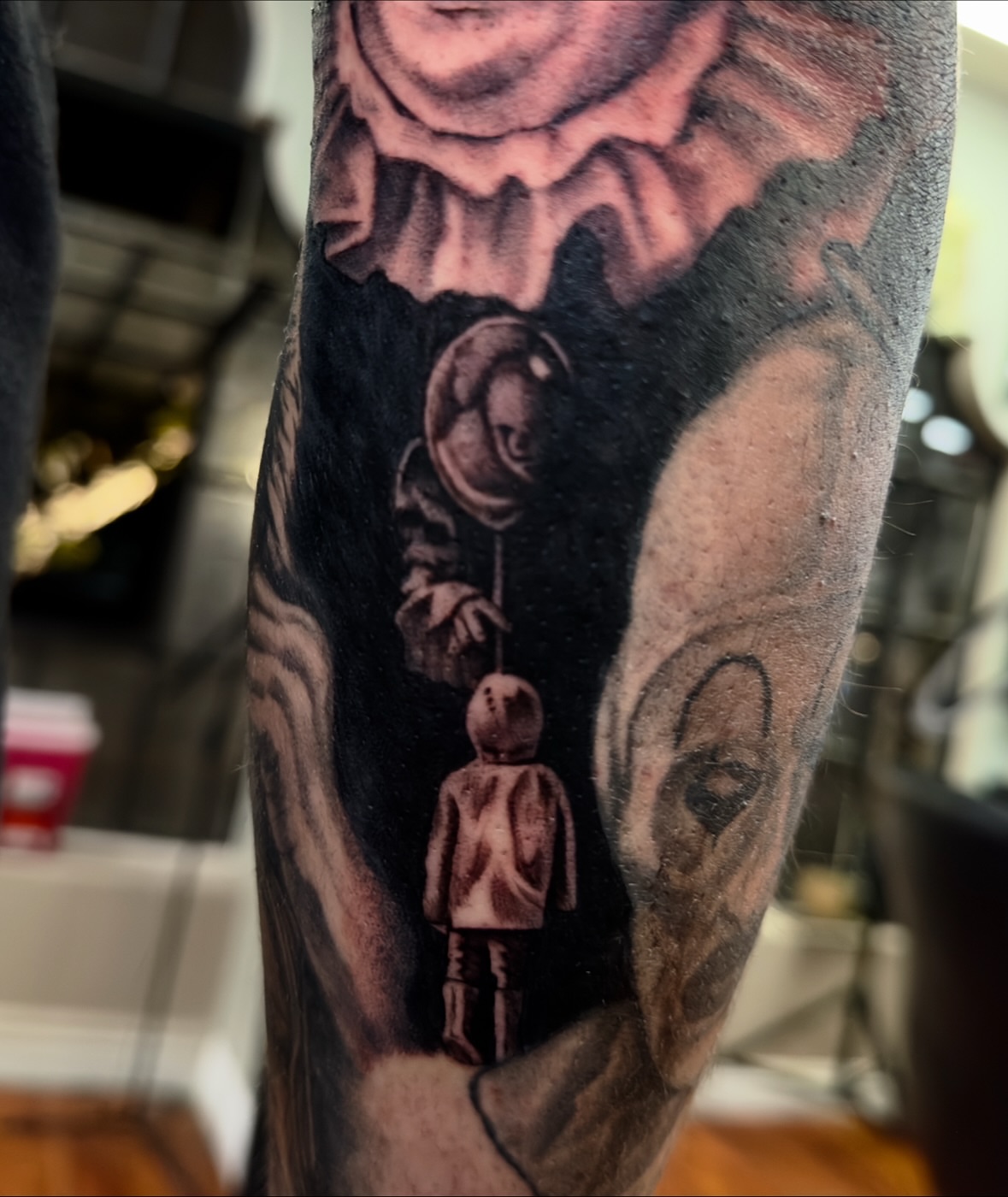 Astronaut and child realism tattoo on the forearm by Marisa Biddle