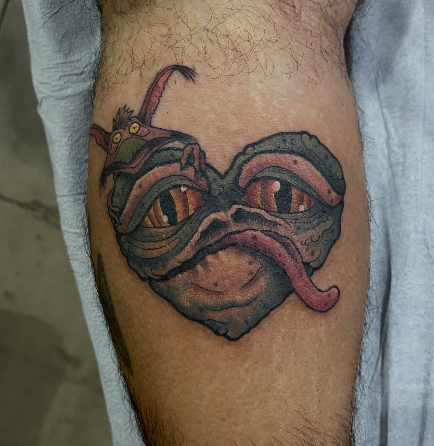 Mask dotwork tattoo on the thigh by Chris Sparks, I just go by Sparks.