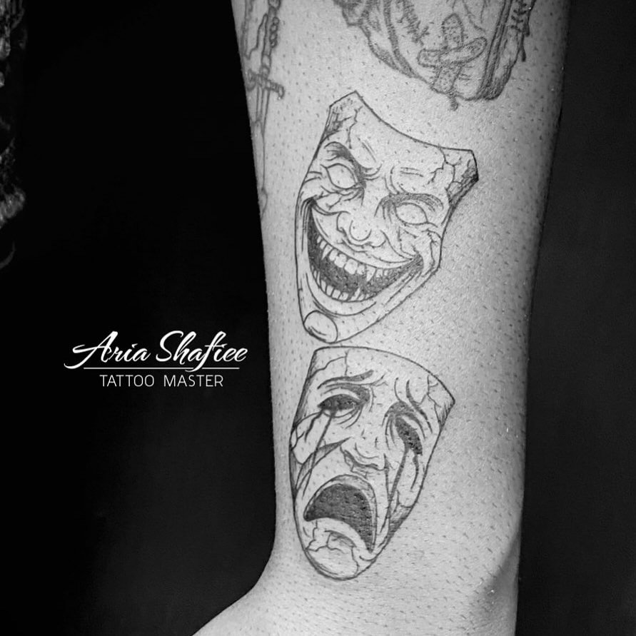 Theater masks dotwork tattoo on the forearm by Aria Shafiee