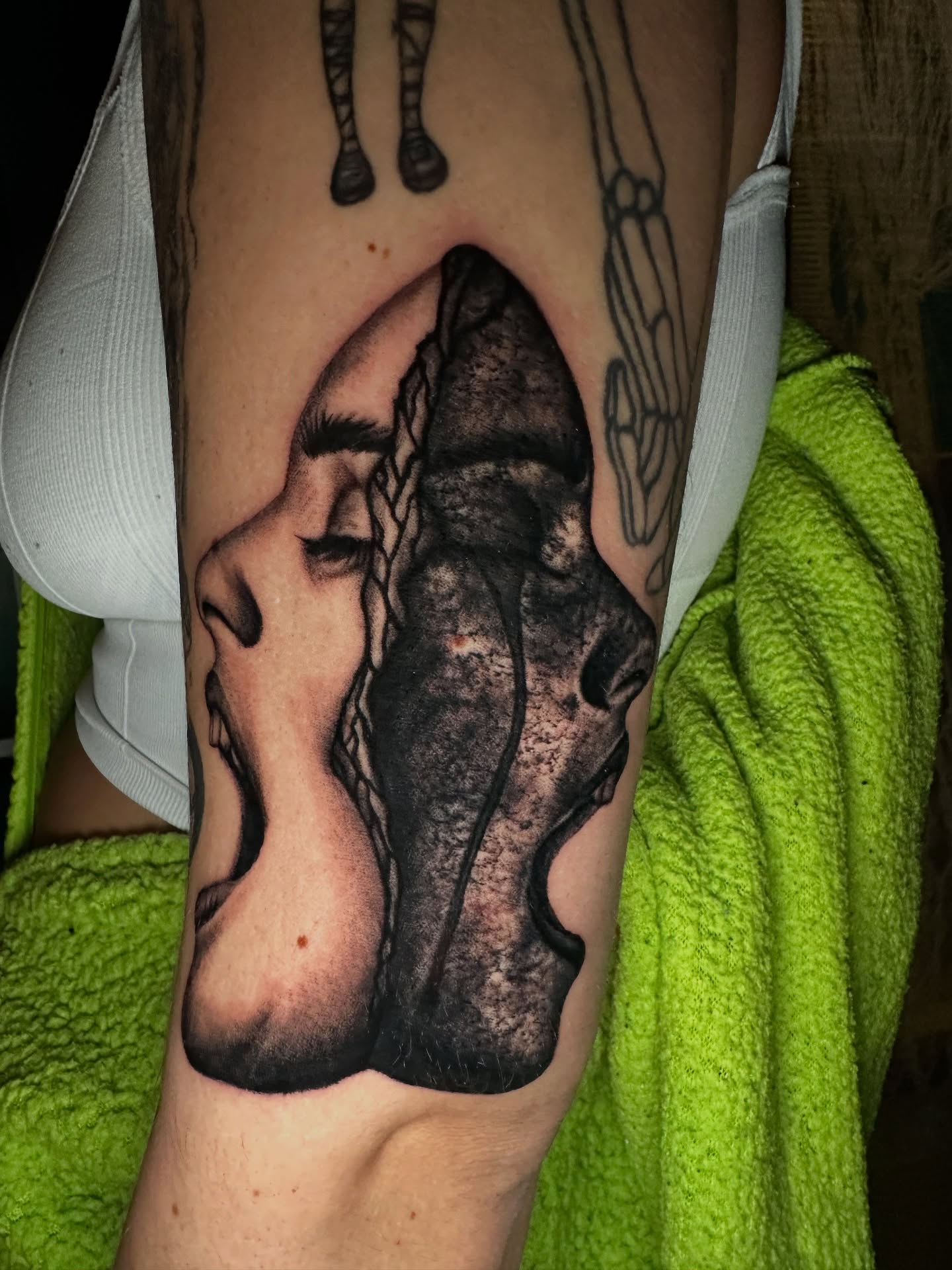 Kissing couple realism tattoo on the forearm by (Joshua) Van Cummings