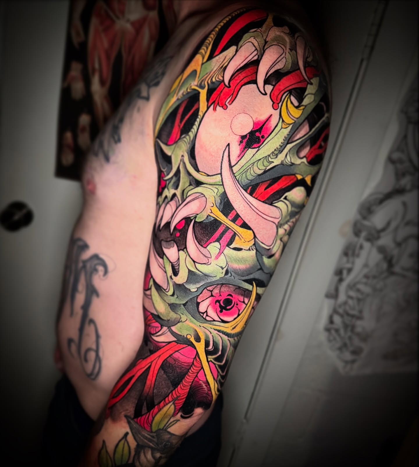 Floral and skeletal motif new school tattoo on the forearm by Emmanuel Mendoza