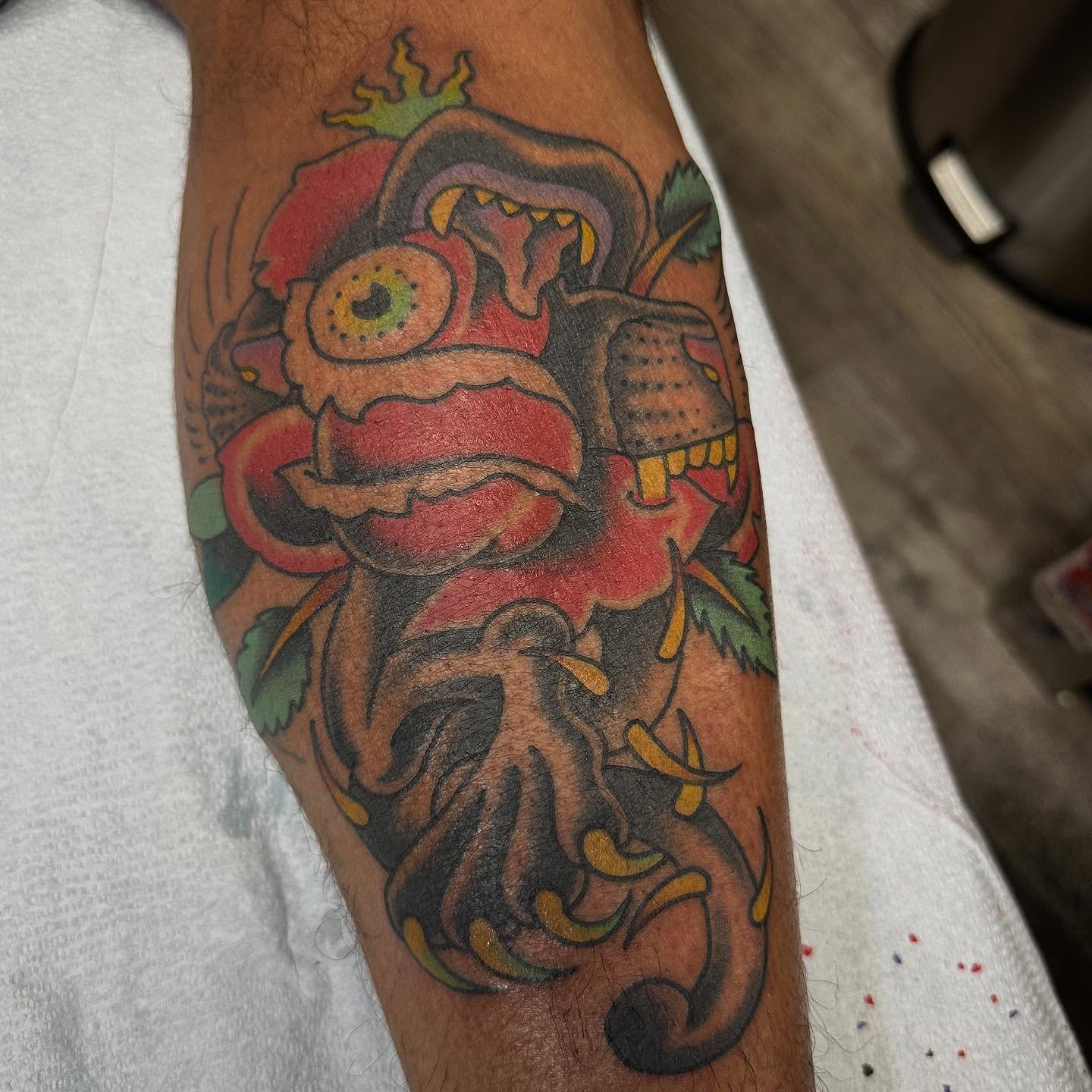 Lion mask American traditional tattoo on the forearm by Devin Spenny