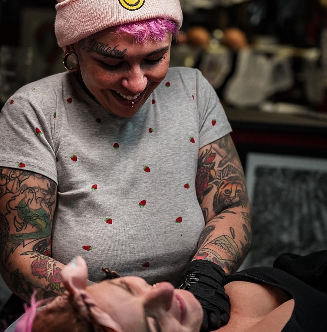 Tattoo artist American traditional tattoo on the upper arm by Bre