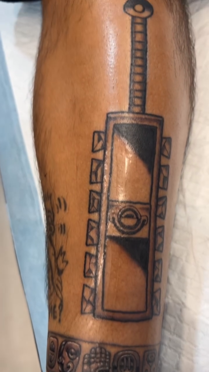 Tribal-inspired sword tattoo minimalist tattoo on the forearm by 🇬🇹