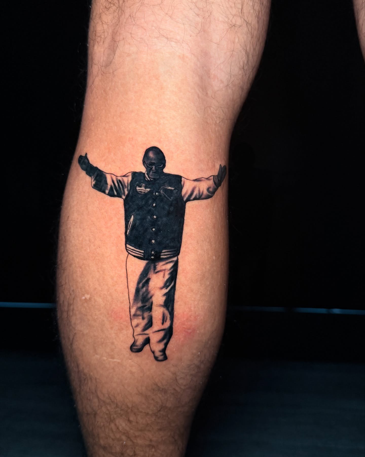 Man in jacket black and grey tattoo on the forearm by Arthur Volper