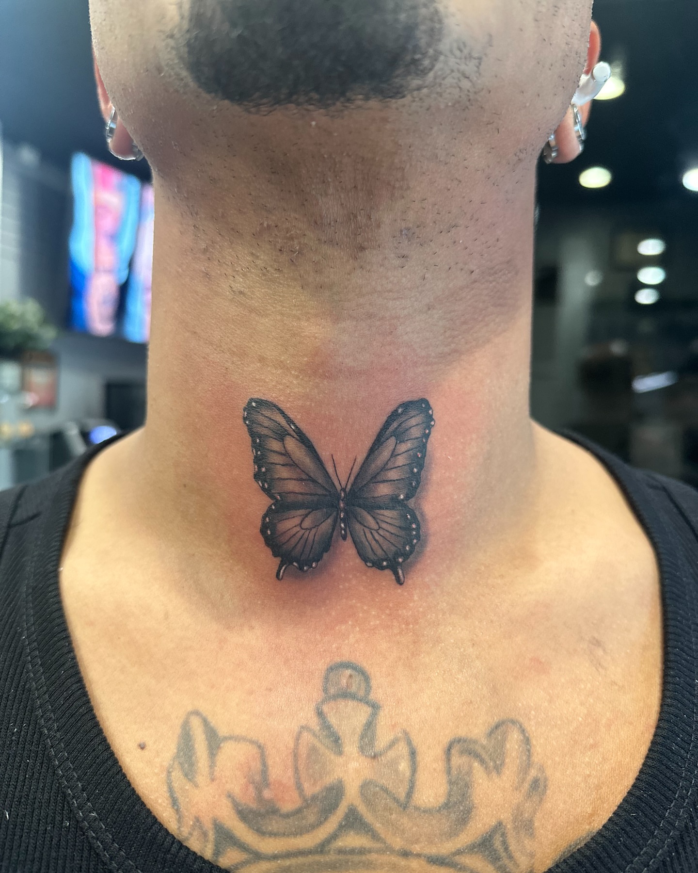 Butterfly realism tattoo on the neck by Arthur Volper
