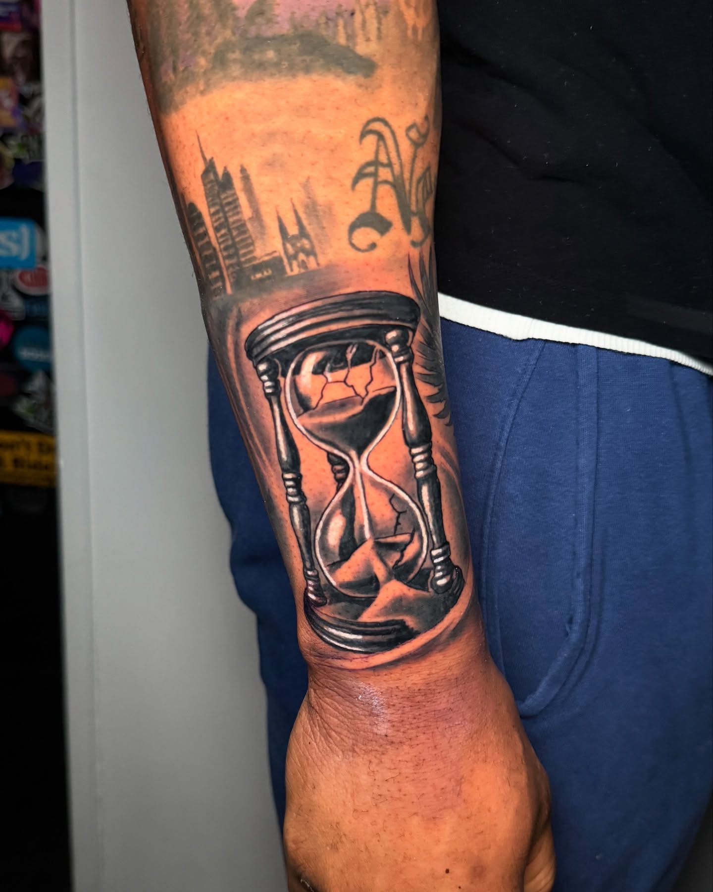 Hourglass realism tattoo on the forearm by Arthur Volper