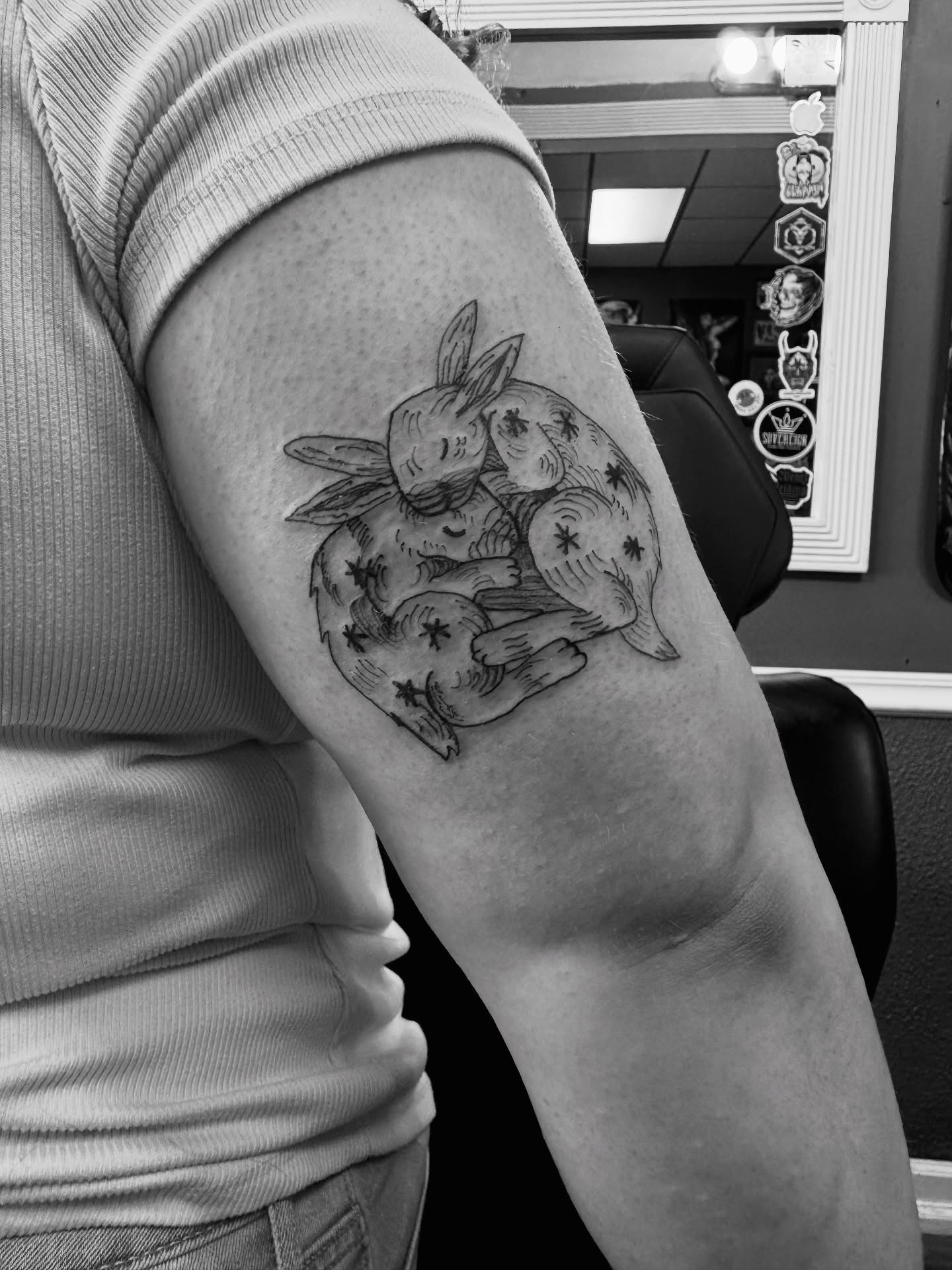 Rabbits black and grey tattoo on the forearm by Lexy