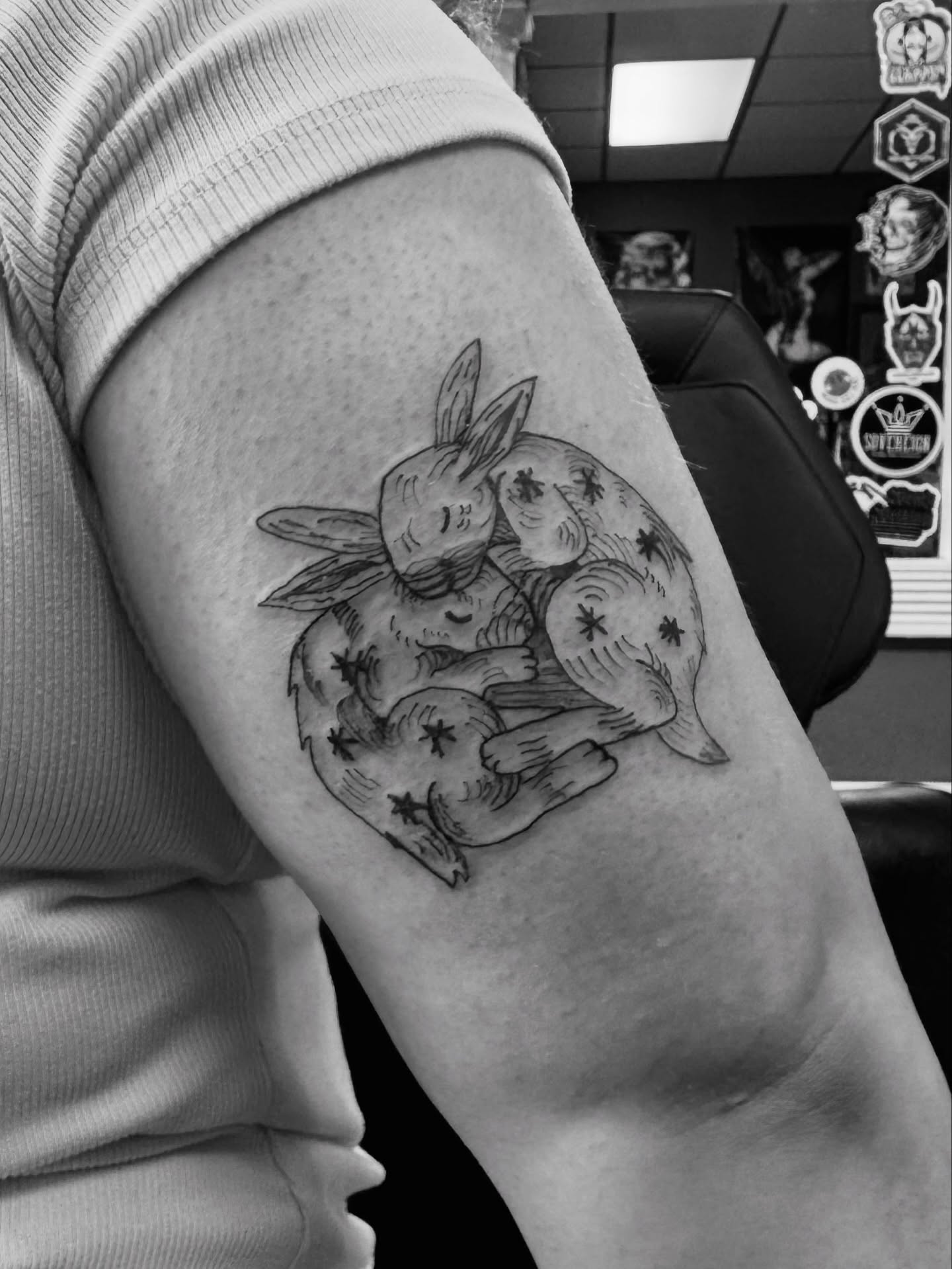 Rabbits black and grey tattoo on the forearm by Lexy