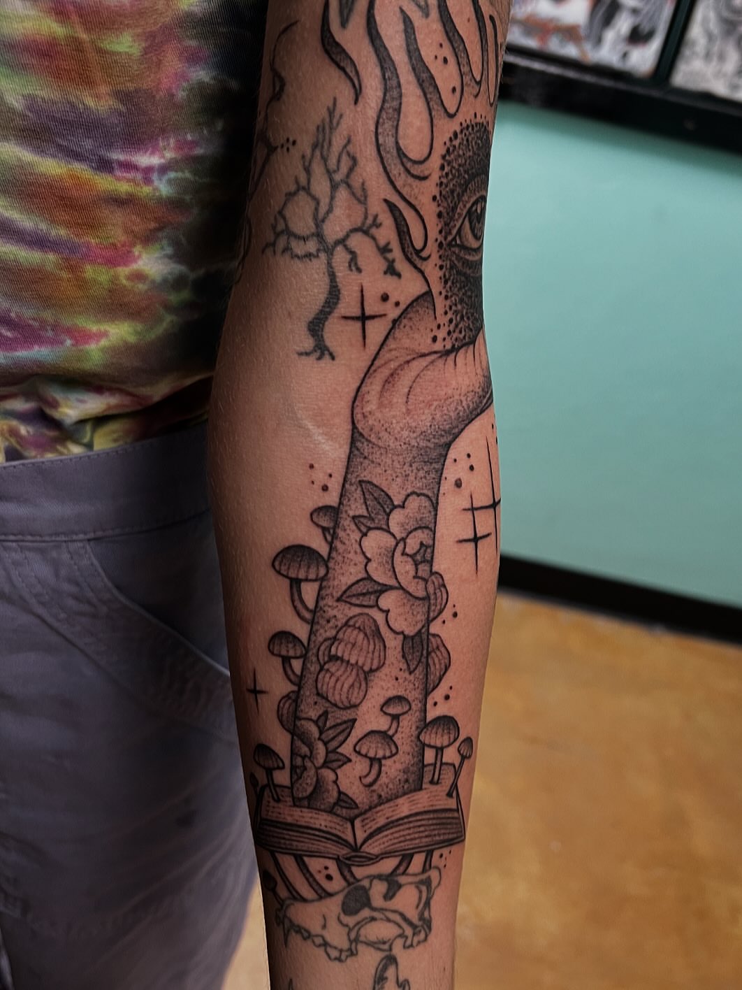 Book and flowers dotwork tattoo on the forearm by Austin Tattoo Artist