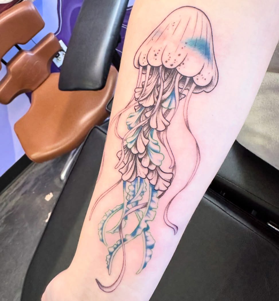 Jellyfish realism tattoo on the forearm by Sarah Nash