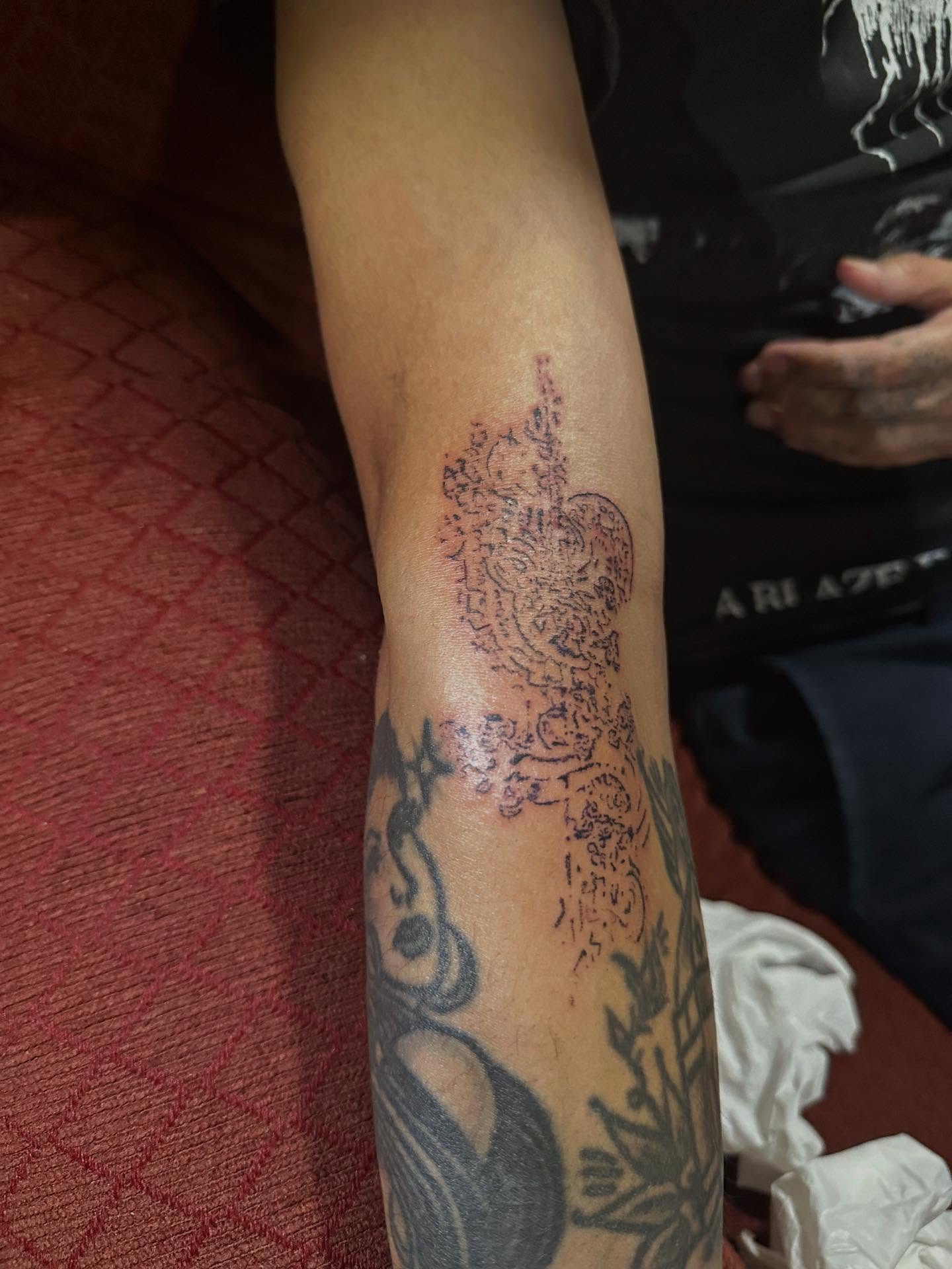 Floral pattern dotwork tattoo on the forearm by Swag Originator