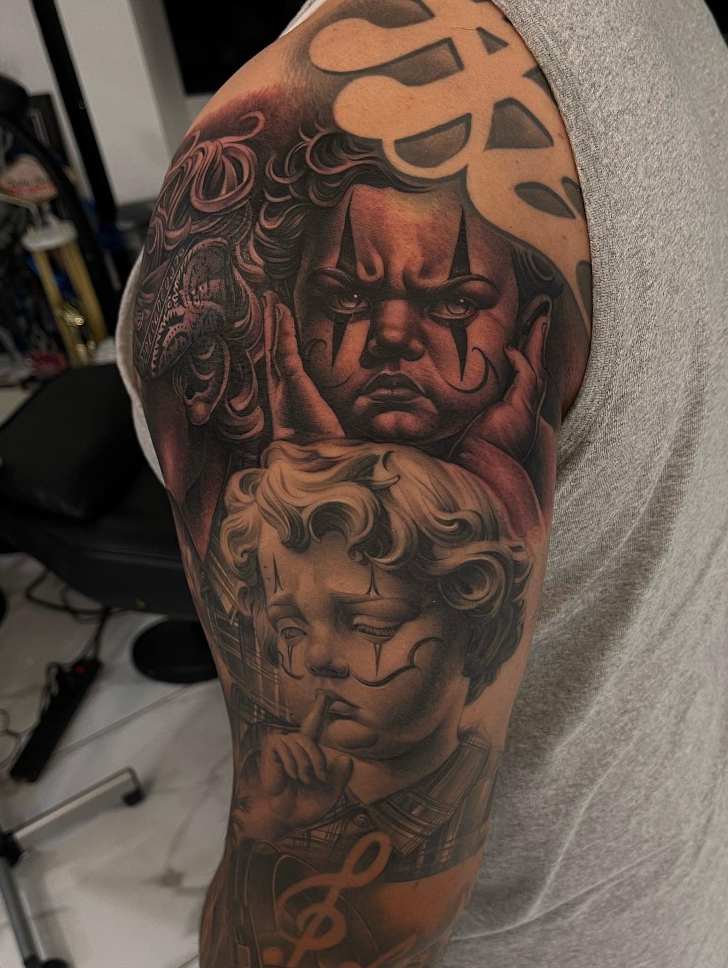 Children realism tattoo on the upper arm by Jayjay🦅