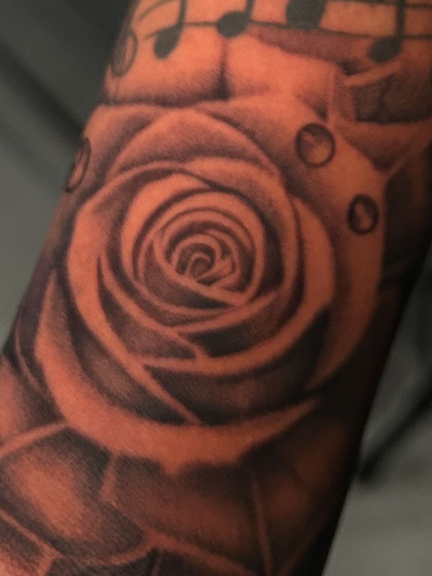 Rose black and grey tattoo on the forearm by Jaylen - Atlanta Tattoo Artist