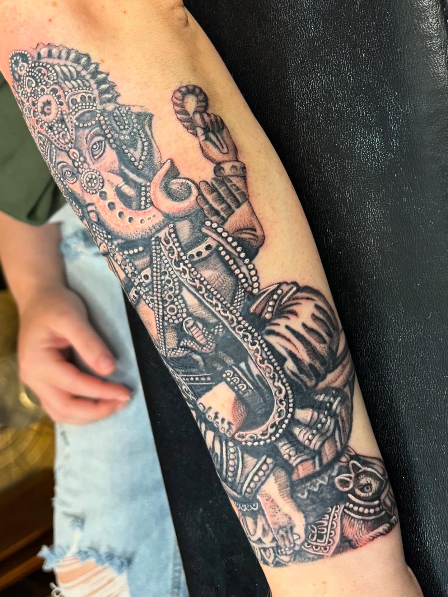 Ganesha black and grey tattoo on the forearm by Misty Locket Realism Tattoo Artist Cover-up