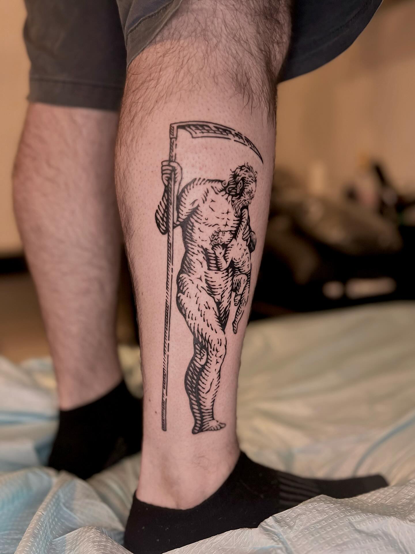 Reaper black and grey tattoo on the calf by Wonny