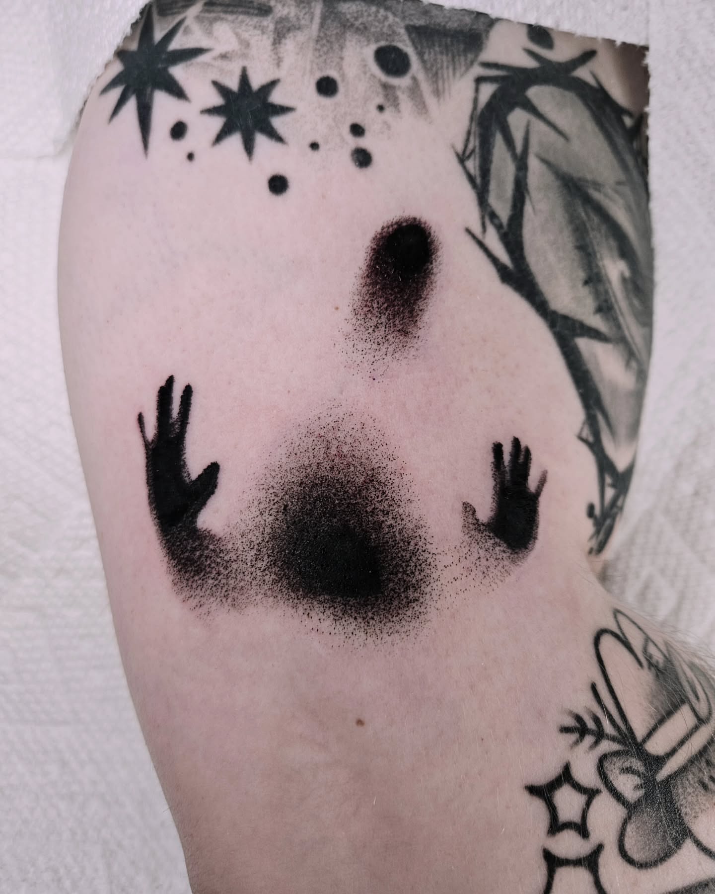 Ghostly figure dotwork tattoo on the forearm by Sabrina Wagner