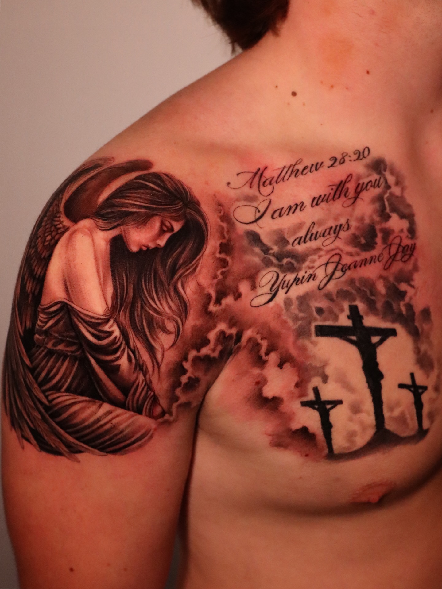 Angel and crucifixion scene realism tattoo on the shoulder by elvis flores