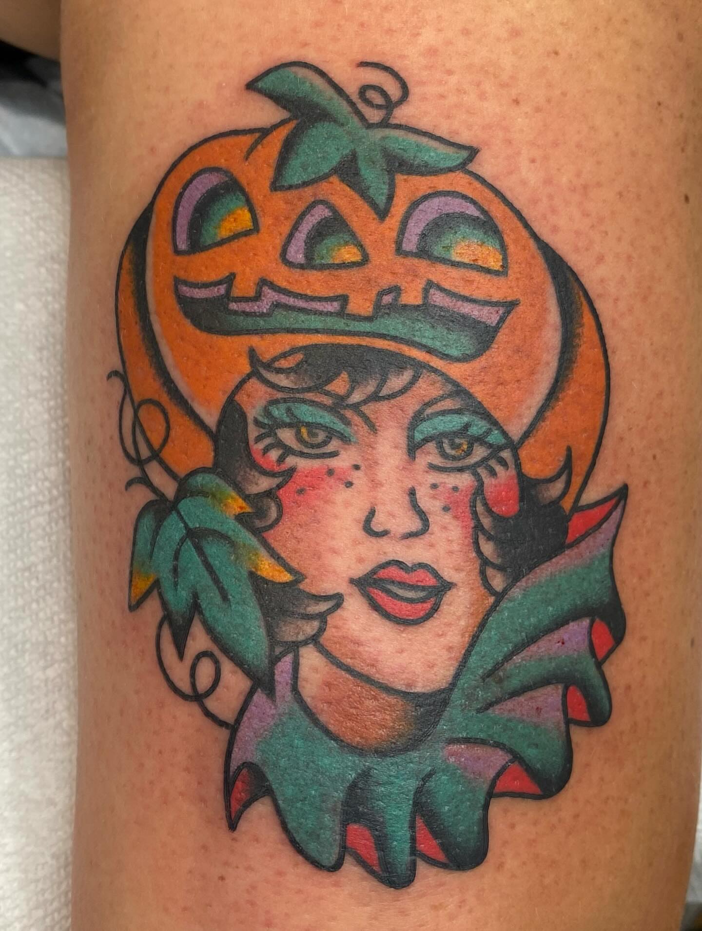 Pumpkin-headed woman American traditional tattoo on the thigh by Kiera ❤️‍🔥