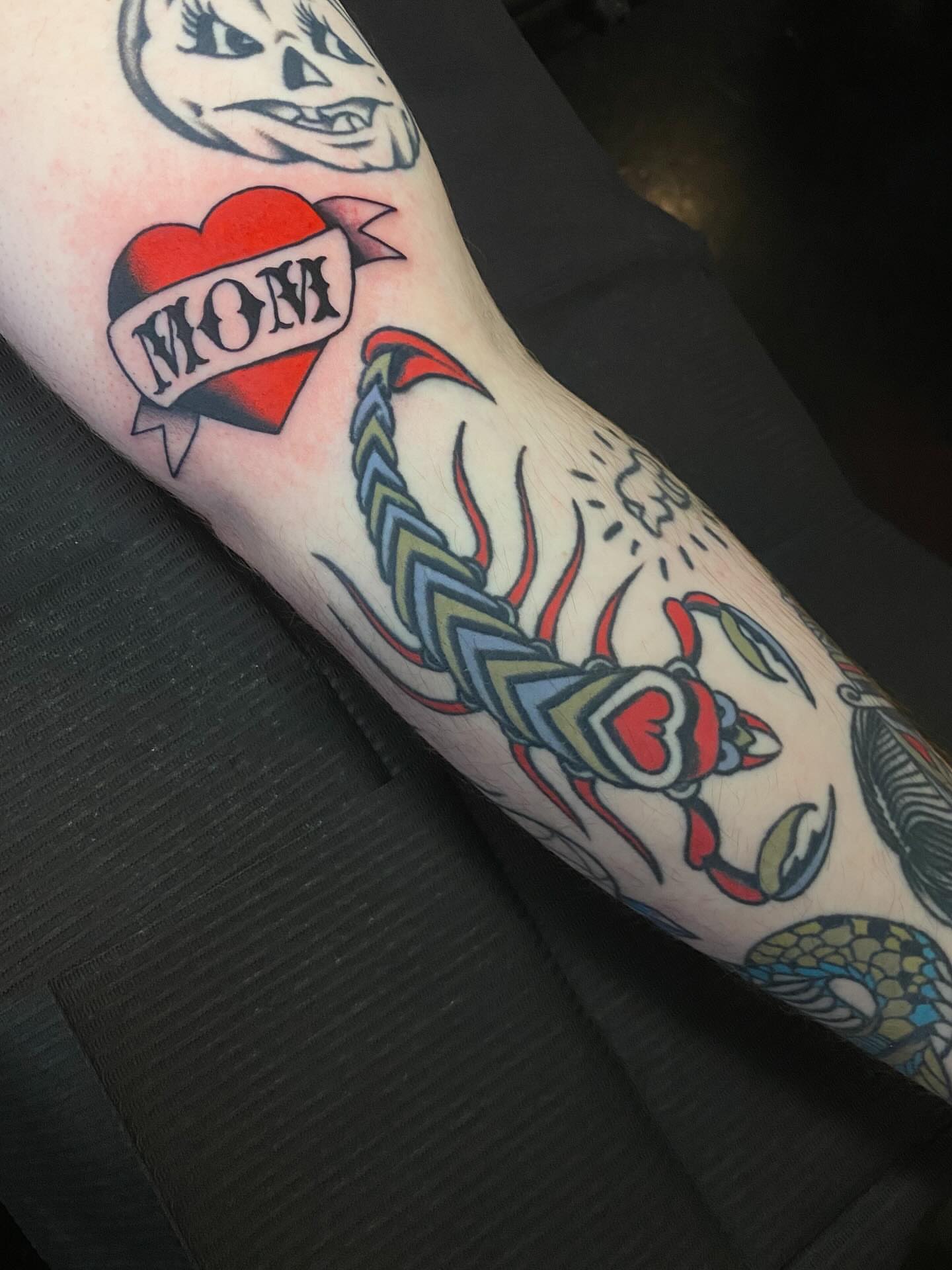 Scorpion and heart American traditional tattoo on the forearm by Jaclin Grace Hastings