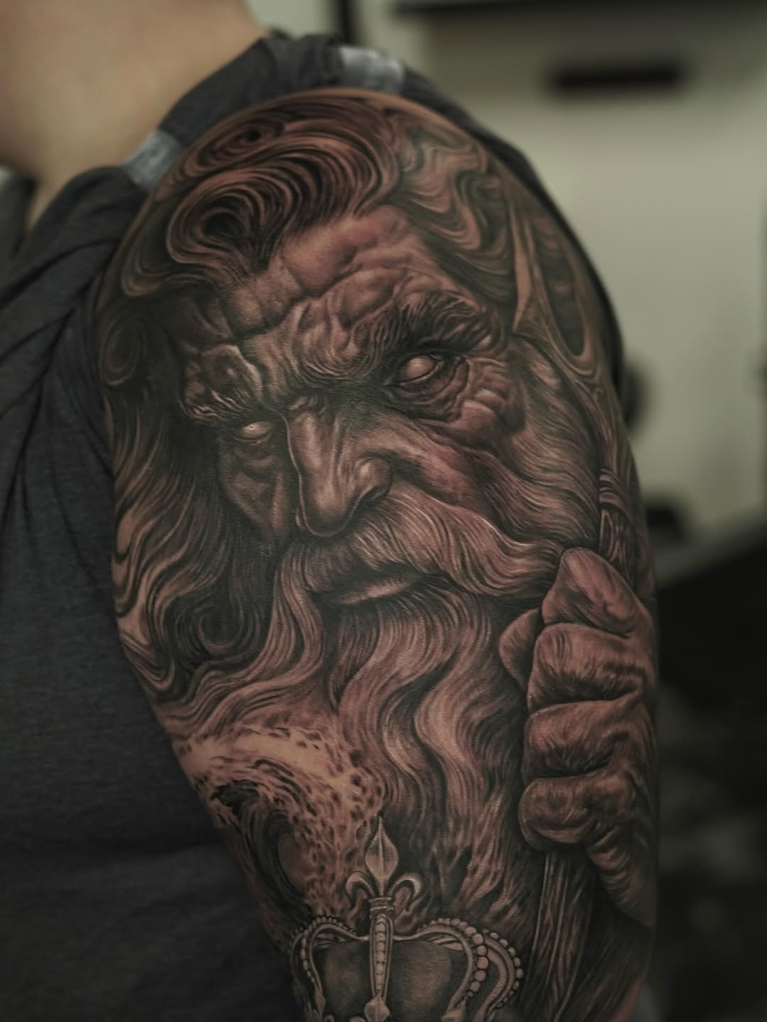 Old man with beard and crown surrealism tattoo on the forearm by Nelson Tellez