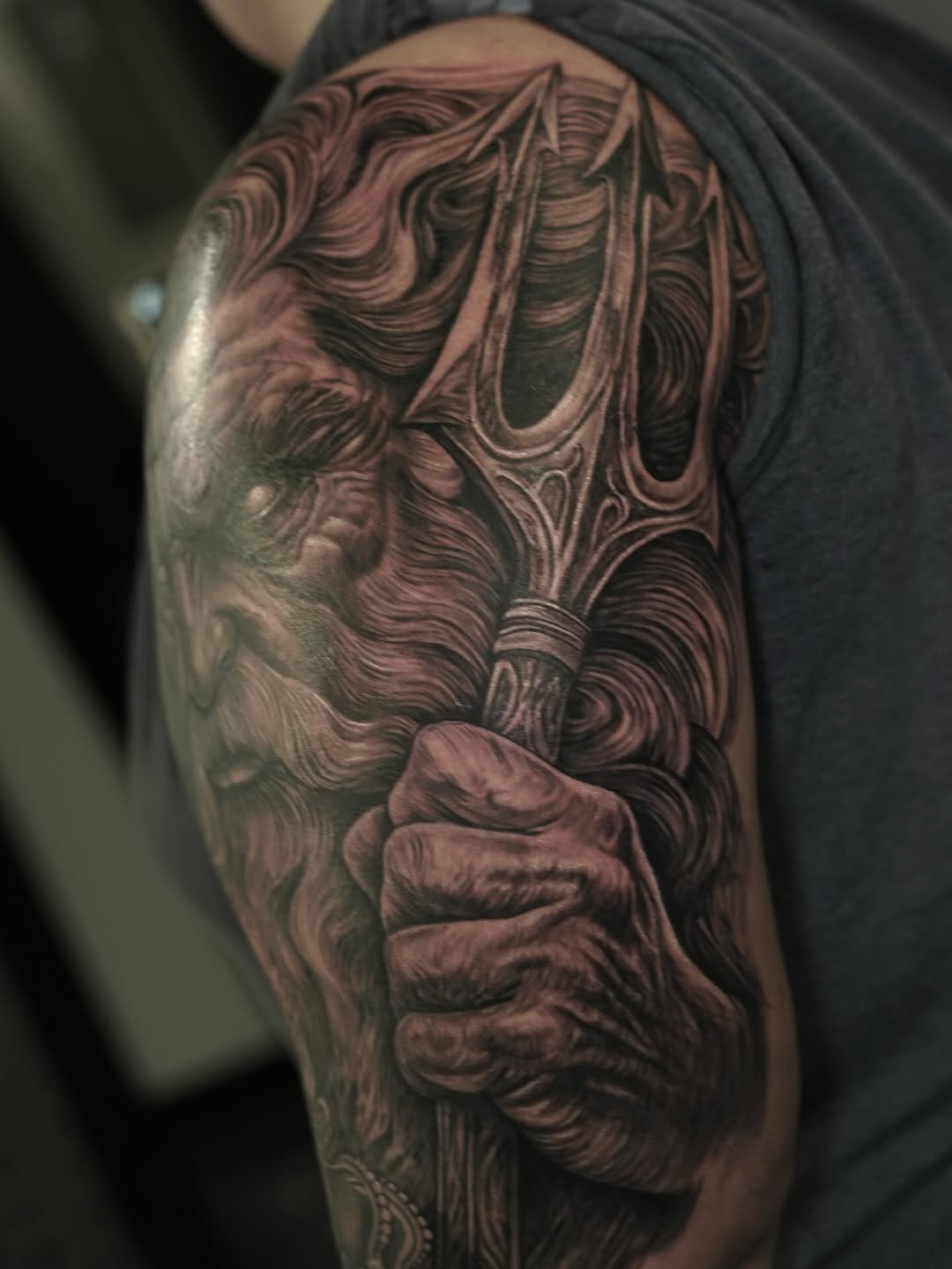Poseidon with trident Japanese tattoo on the shoulder by Nelson Tellez
