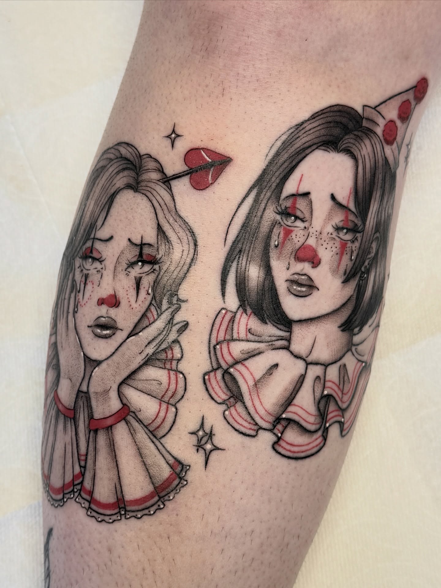 Clown girls dark realism tattoo on the forearm by Hannah May, La Mesa, California
