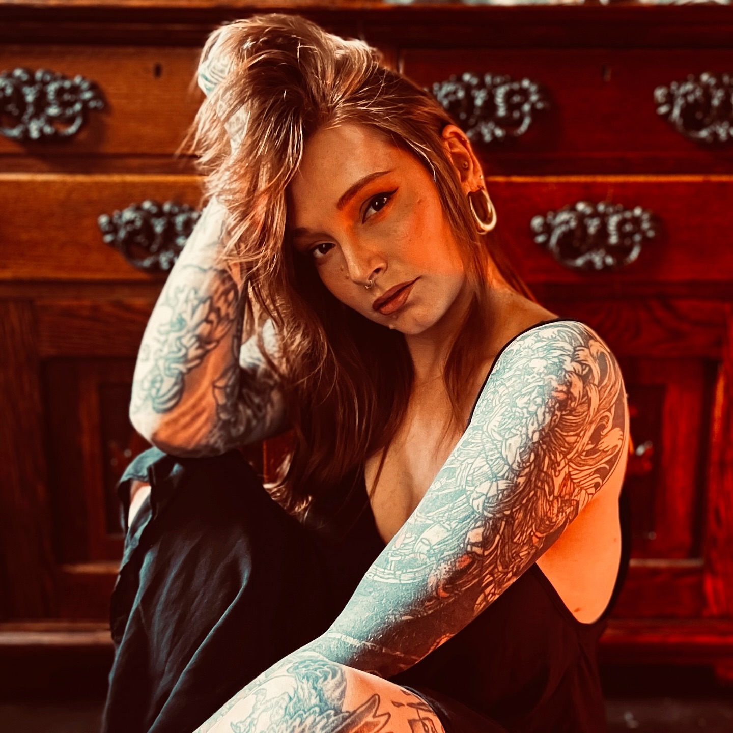 Tattooed arms American traditional tattoo on the upper arm by Amanda Leitch