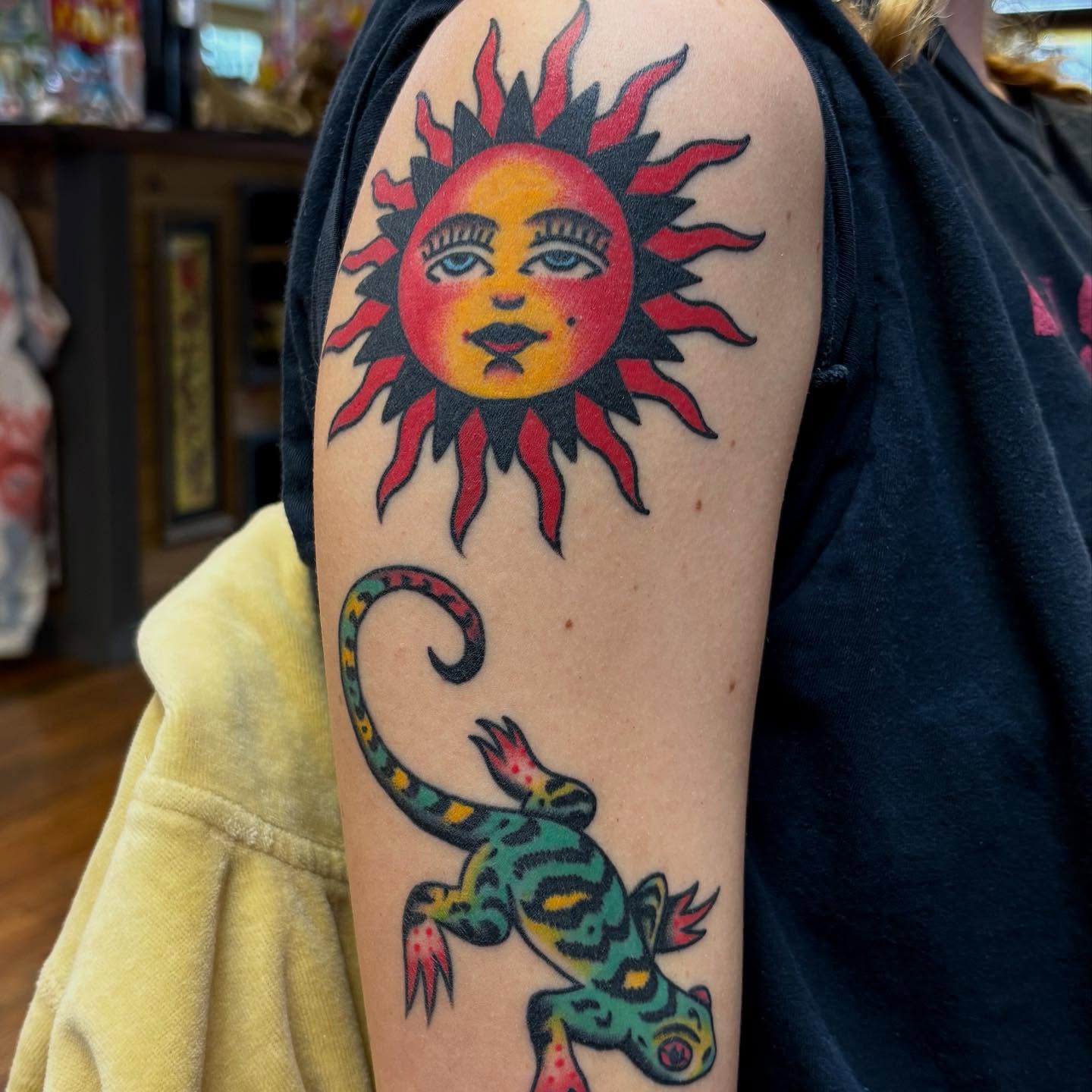 Sun and lizard American traditional tattoo on the forearm by Izzy