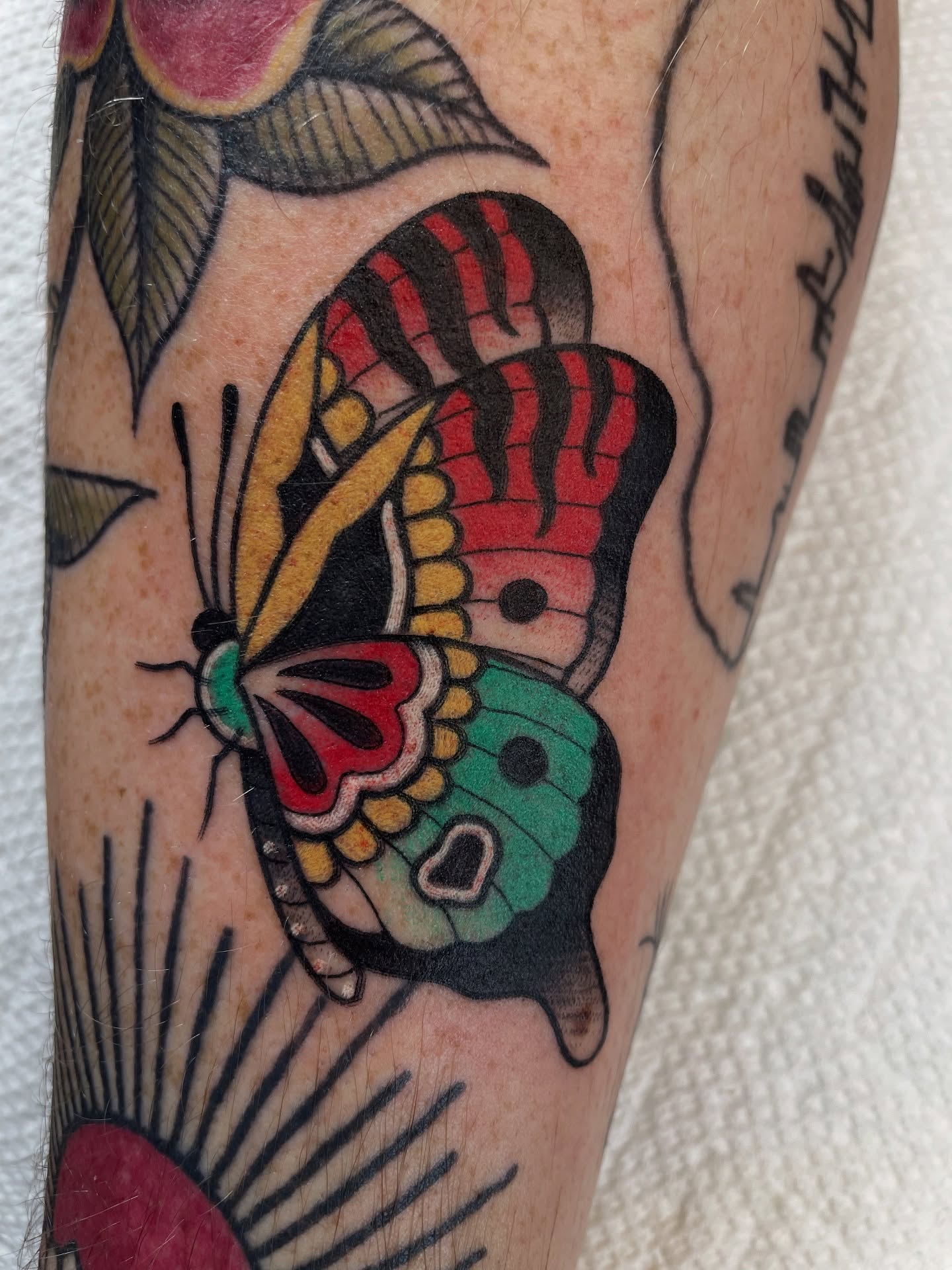 Butterfly American traditional tattoo on the forearm by Josh Johns