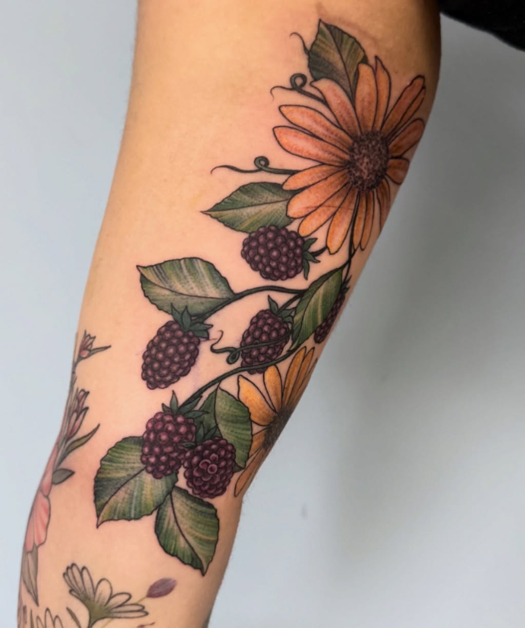 Sunflower and berries realism tattoo on the forearm by Eva, Matawan, New Jersey