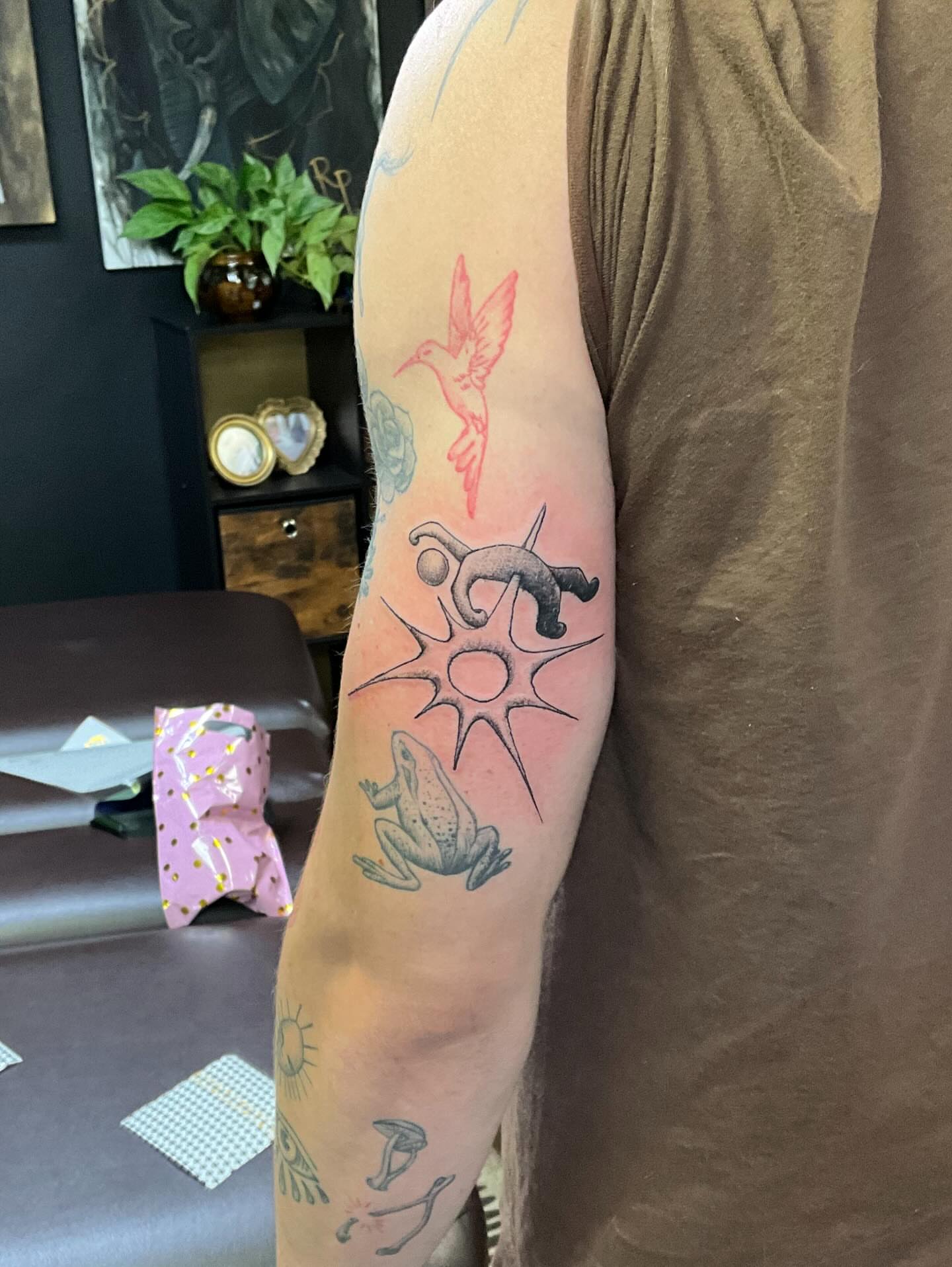 Sun, frog, monkey, hummingbird, flower new school tattoo on the forearm by Khang🇻🇳