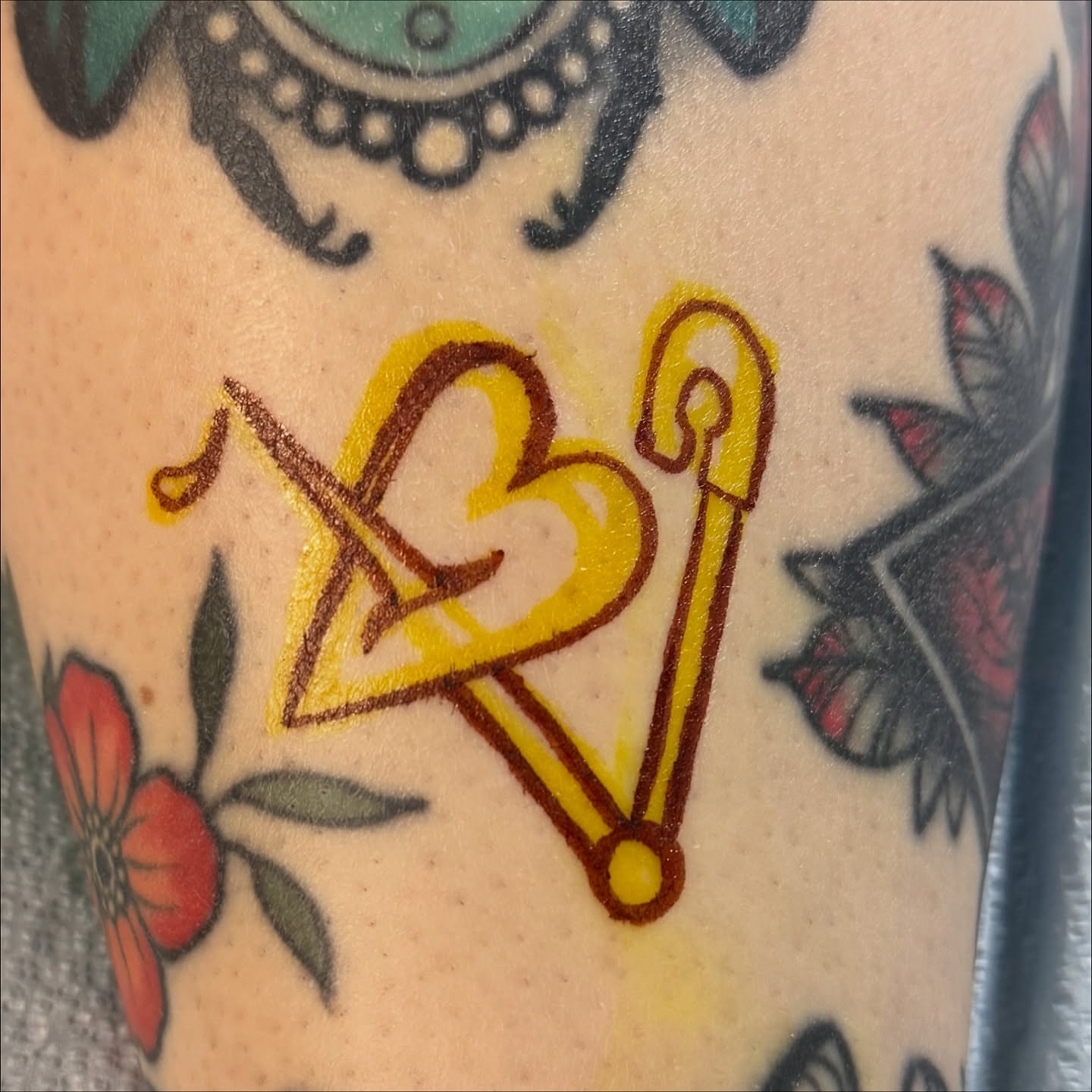 Heart and staff American traditional tattoo on the forearm by Ash Nicola, Asheville, North Carolina