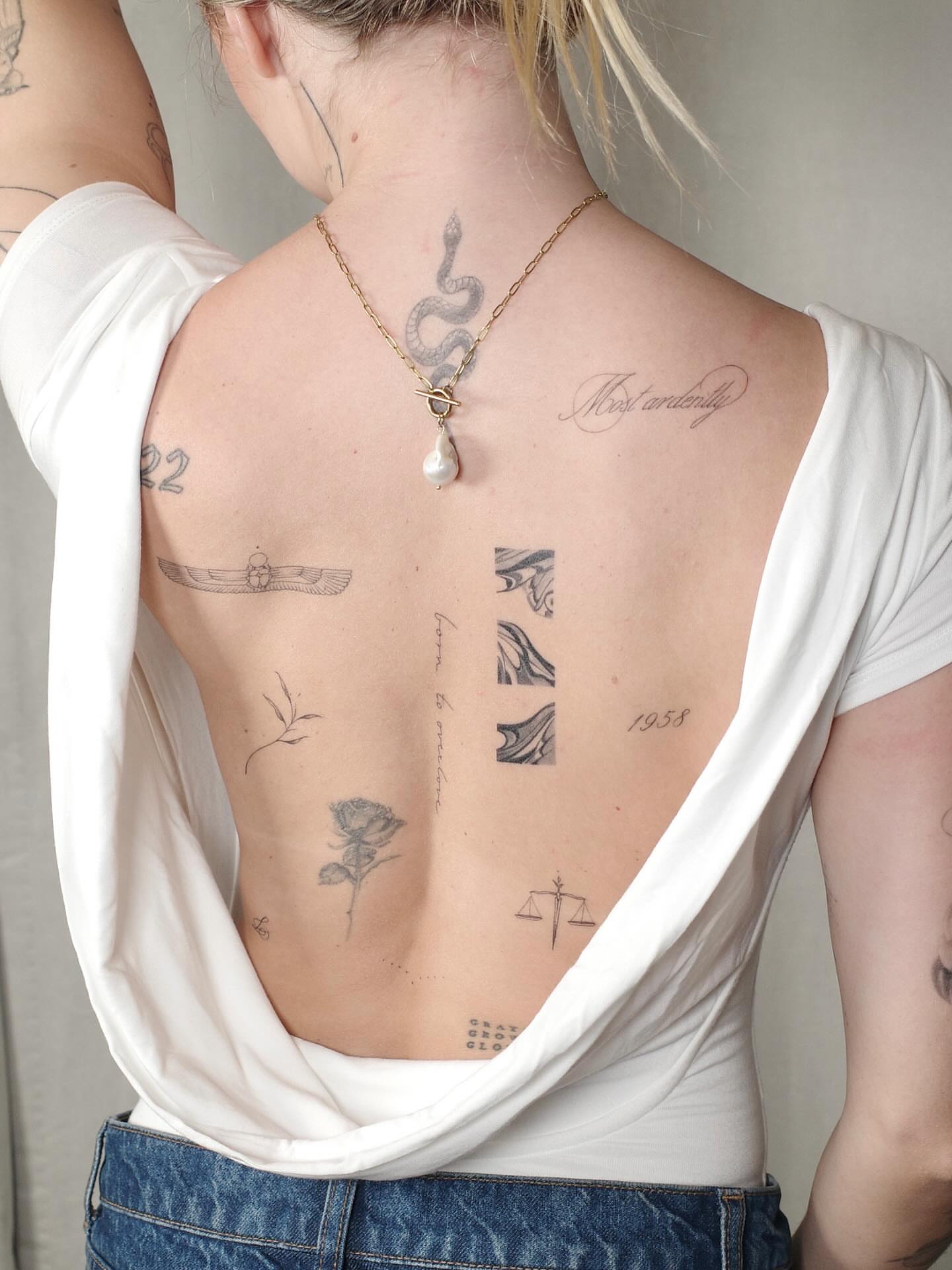 Spine tattoo black and grey tattoo on the back by River, New York, New York