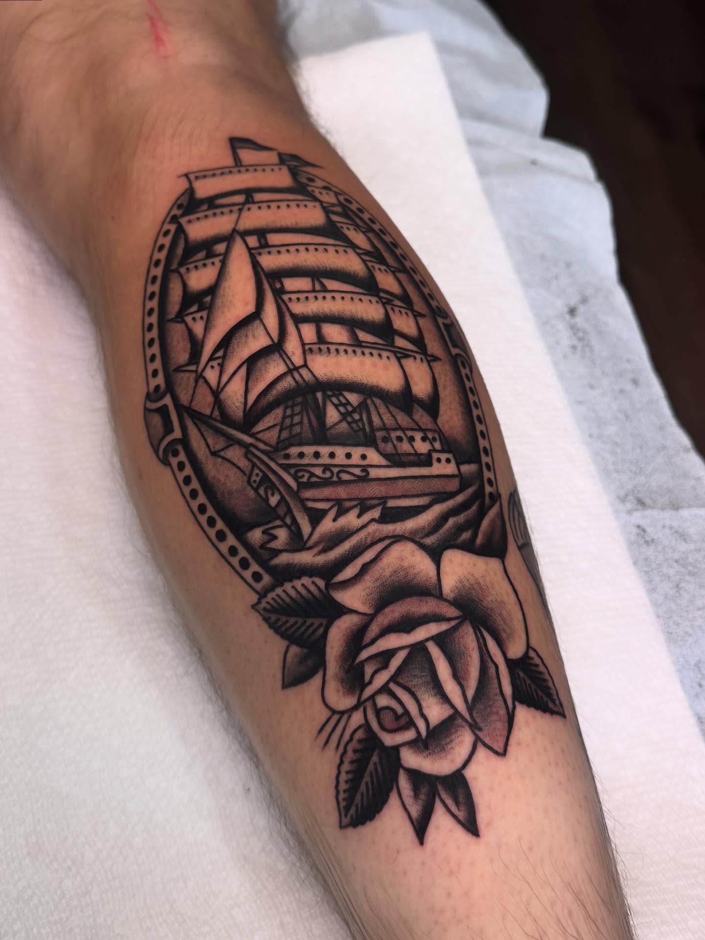 Ship and rose American traditional tattoo on the forearm by Ryan Engels