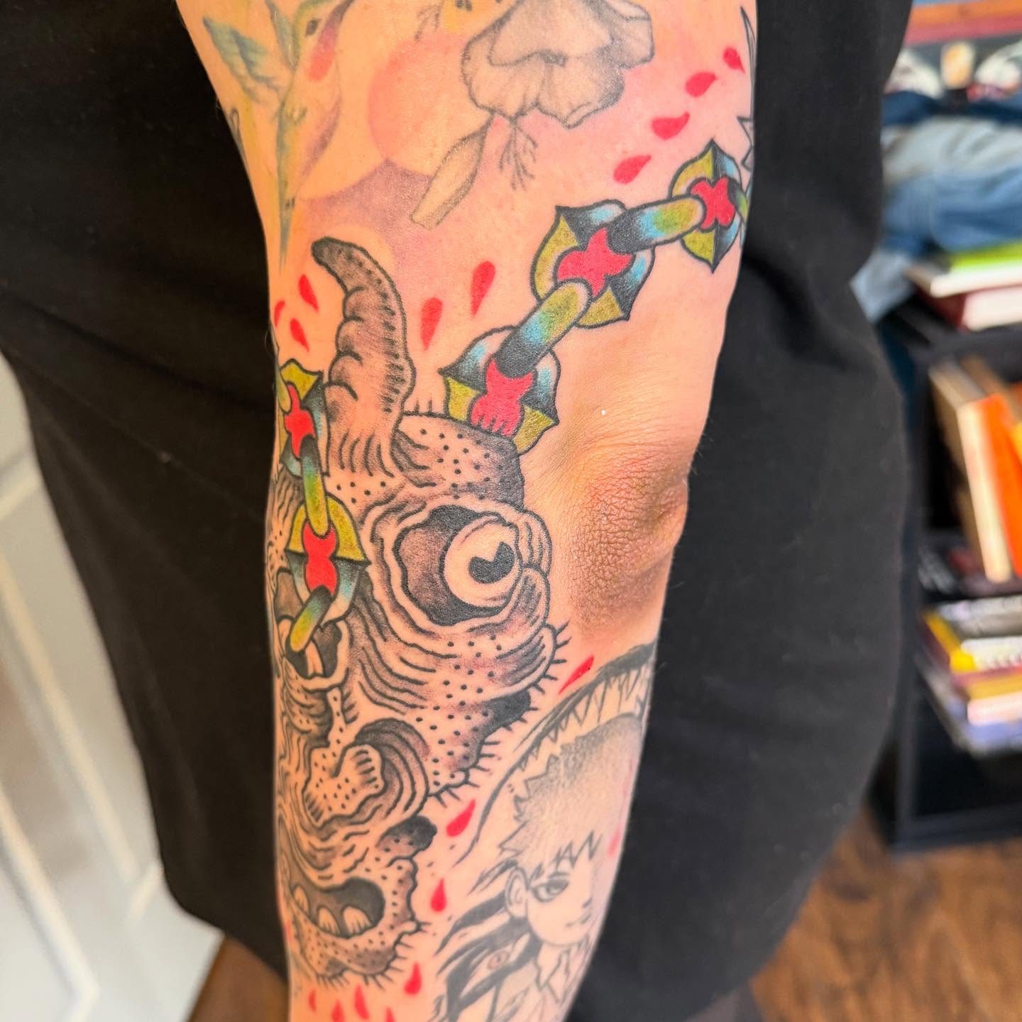Fish and sword American traditional tattoo on the forearm by Joe Truck