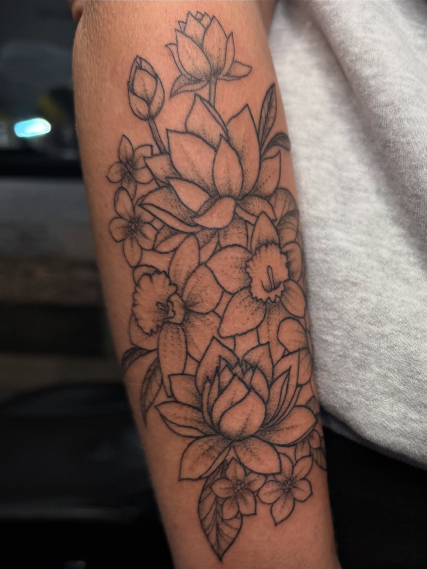 Lotus flowers dotwork tattoo on the forearm by Tina Petrullo, West Chester Township, Butler County, Ohio