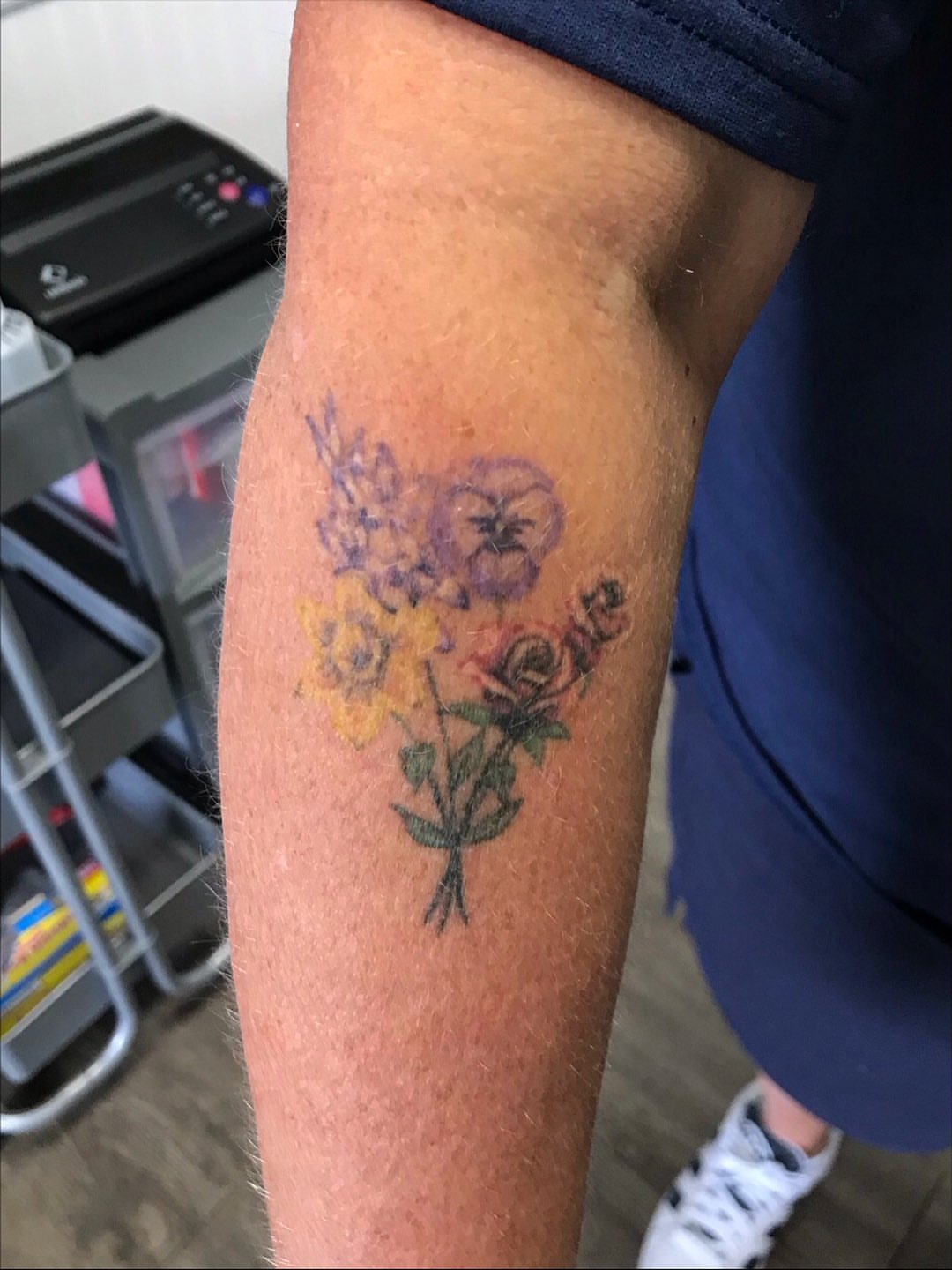 Flower bouquet dotwork tattoo on the forearm by Cortnie, Nashville, Tennessee