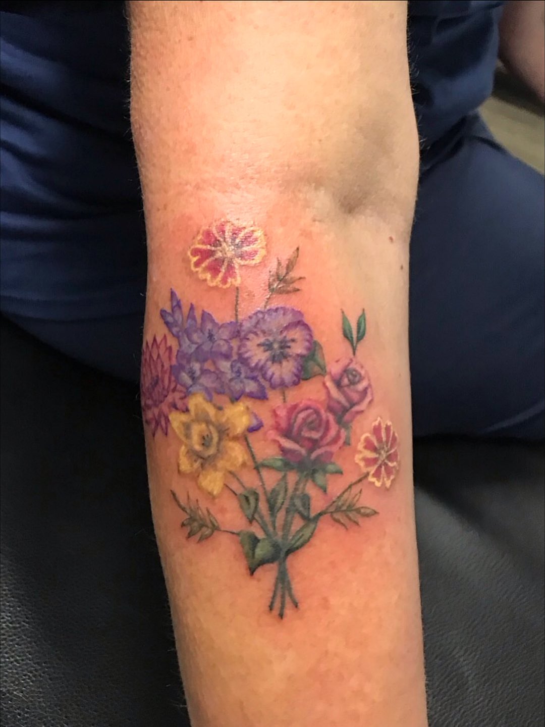 Flower bouquet new school tattoo on the forearm by Cortnie, Nashville, Tennessee