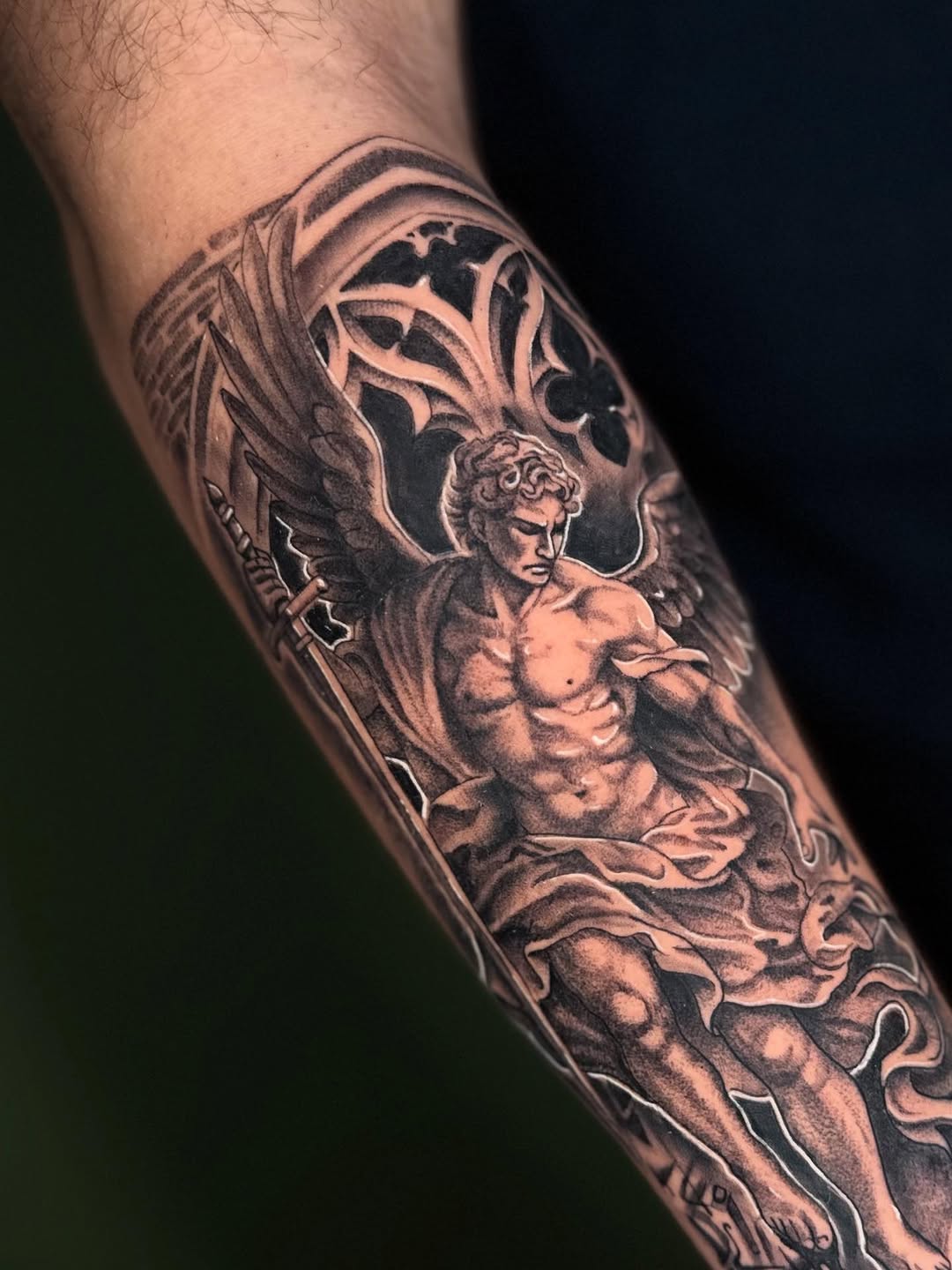 Angel with sword realism tattoo on the forearm by Terence Taylor