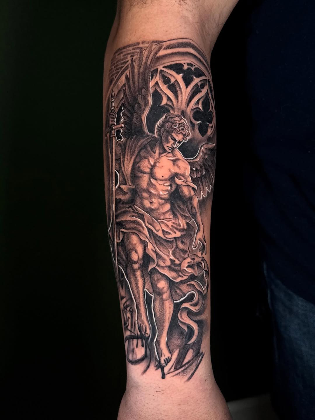 Angel with sword realism tattoo on the forearm by Terence Taylor