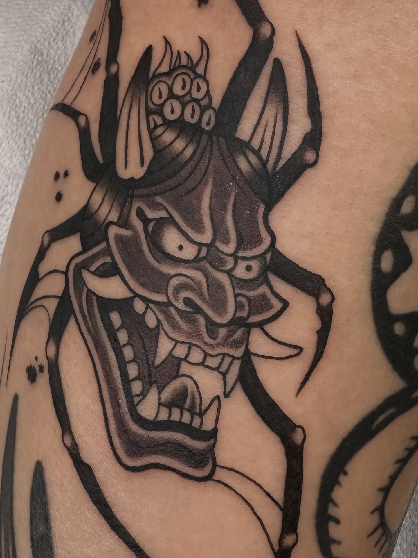 Demon mask black and grey tattoo on the forearm by Las Vegas Tattoo Artist π€ Nani