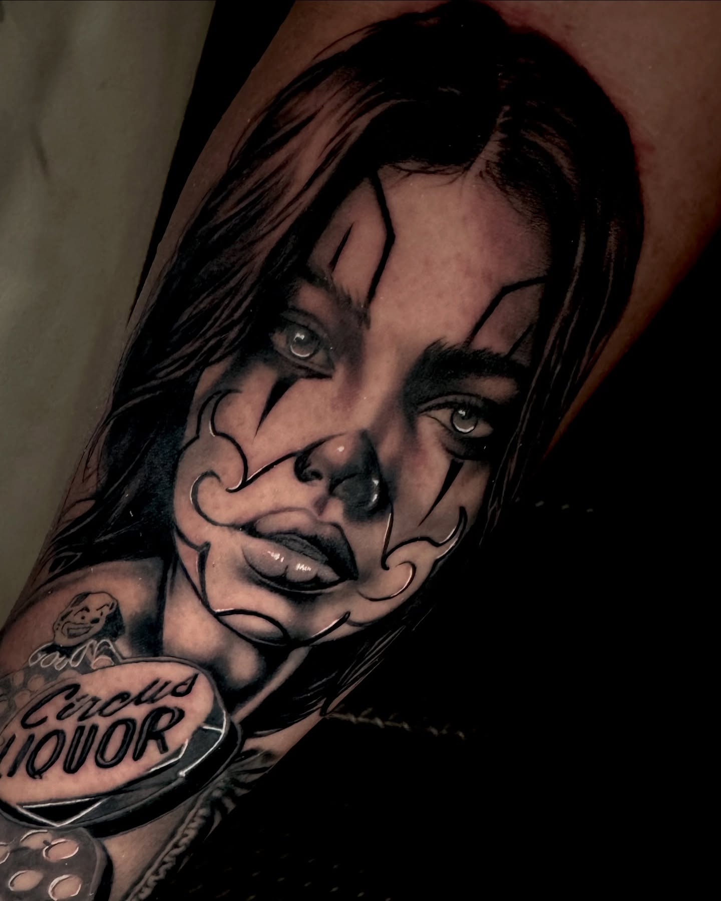 Woman's face realism tattoo on the forearm by Gabriel Quintana “Q”