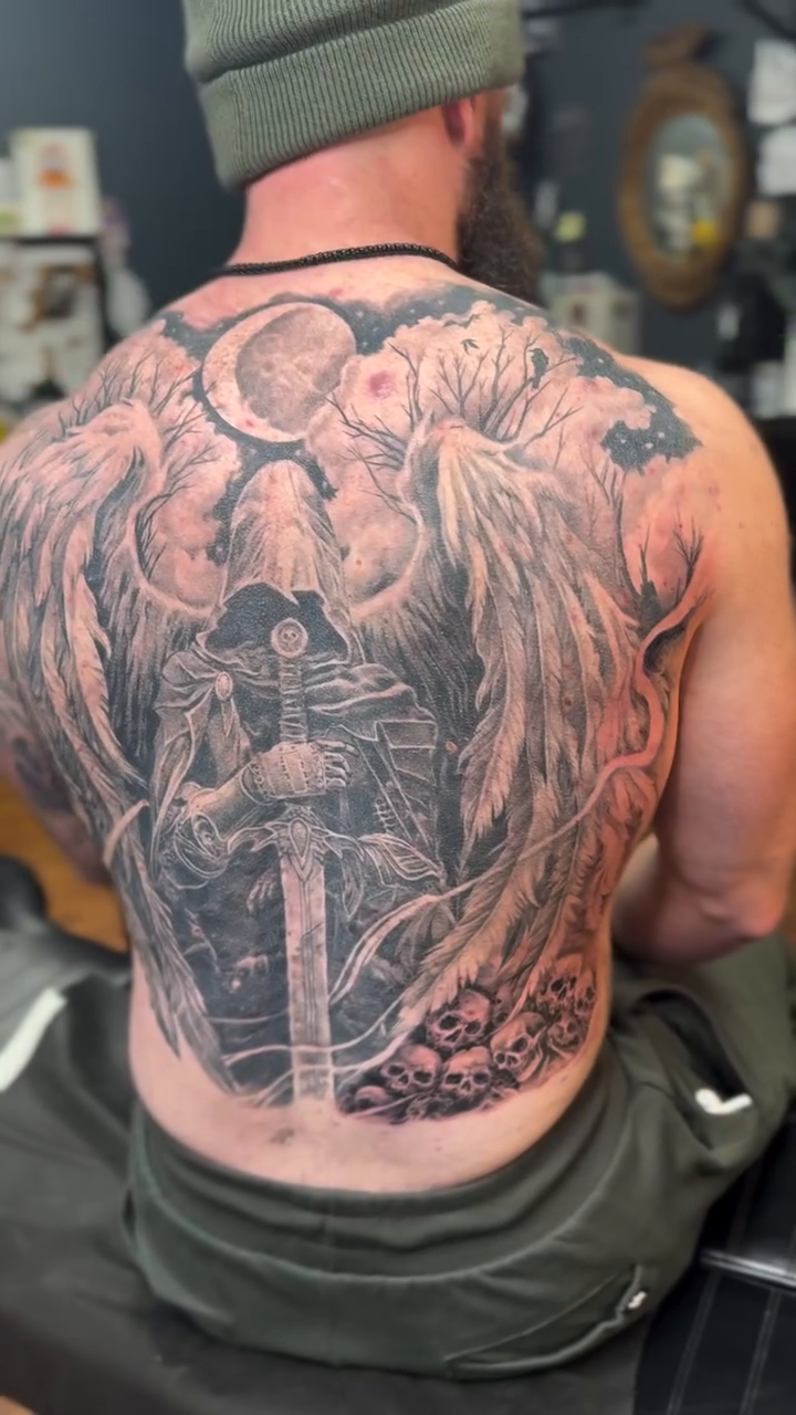 Warrior with wings and sword dark realism tattoo by Hori Shit